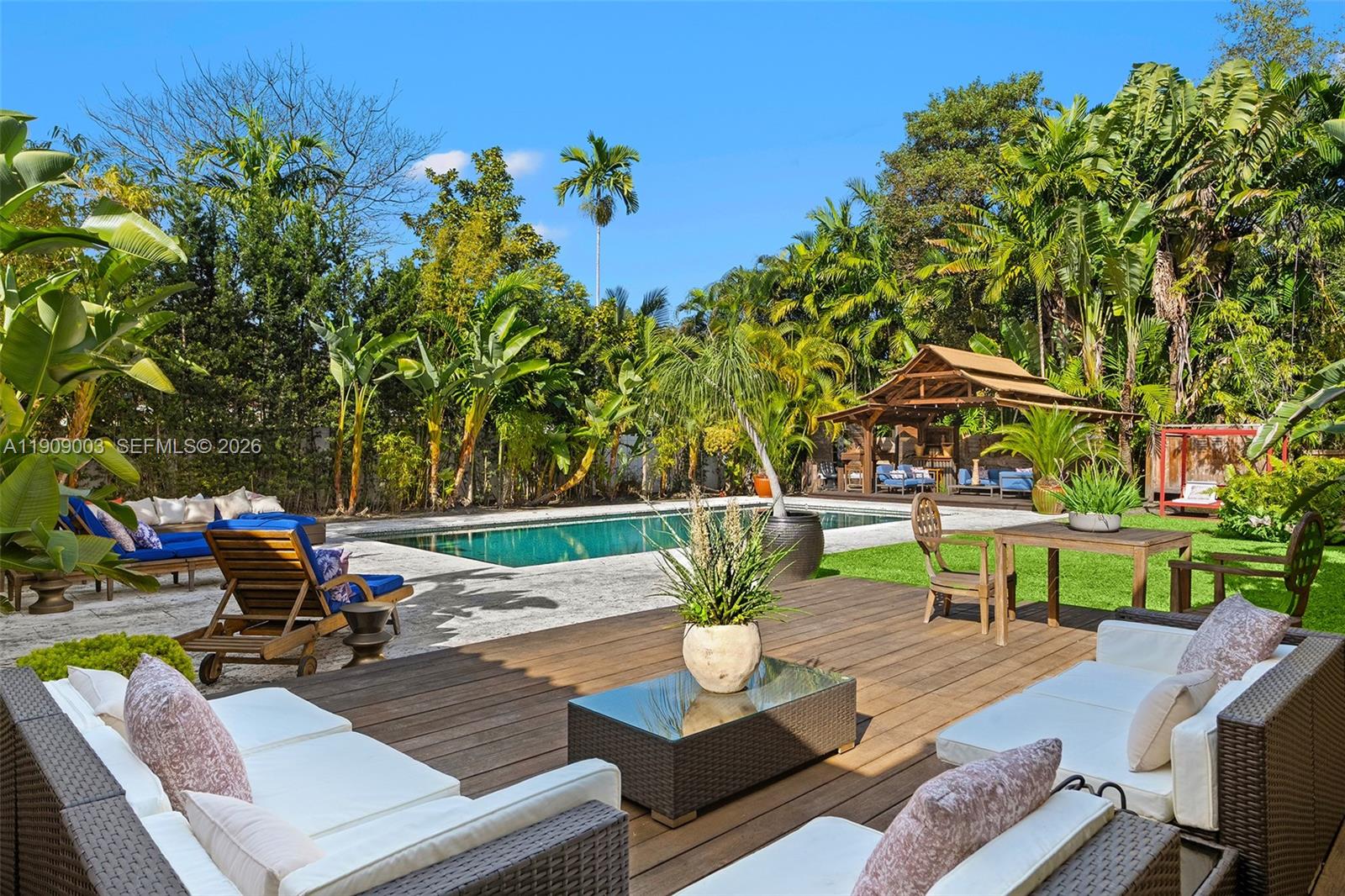 Welcome to Casa Luna — a tranquil, renovated one-story residence located within the exclusive gated community of Bay Point. Set on a double lot spanning 25,380 sq ft, this serene retreat offers the perfect balance of privacy, comfort, and connection to nature. Thoughtfully designed with a split floor plan, the home features five beds and five baths, including a guest suite and maid’s quarters. Light-filled living spaces flow effortlessly outdoors, where lush landscaping surrounds a Balinese-style pergola, outdoor soaking tub, and oversized pool framed by fruit trees and natural light. Peacefully secluded yet ideally located near Miami Beach, the Design District, Midtown, and Wynwood, Casa Luna offers a unique blend of serenity and convenience in the heart of Miami.
