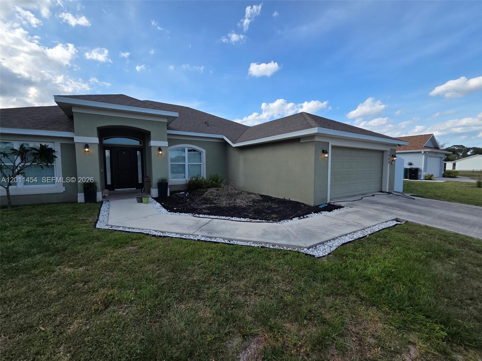 This exceptional residence, built in 2018, offers an impressive blend of elegance, comfort, and functionality. Featuring four generously sized bedrooms, three well-appointed bathrooms, and an additional den that can be utilized as a home office or flex space, the property provides ample room for both relaxation and productivity. The interior is thoughtfully designed with tile flooring throughout the main living areas, enhancing both durability and aesthetic appeal, while plantation shutters add a touch of sophistication and privacy. The modern kitchen is equipped with high-quality stainless steel appliances, making it ideal for everyday living as well as entertaining. Conveniently situated in a desirable location, the home is in close proximity to reputable schools, scenic parks, and a variety of shopping and dining options, offering both convenience and a vibrant lifestyle