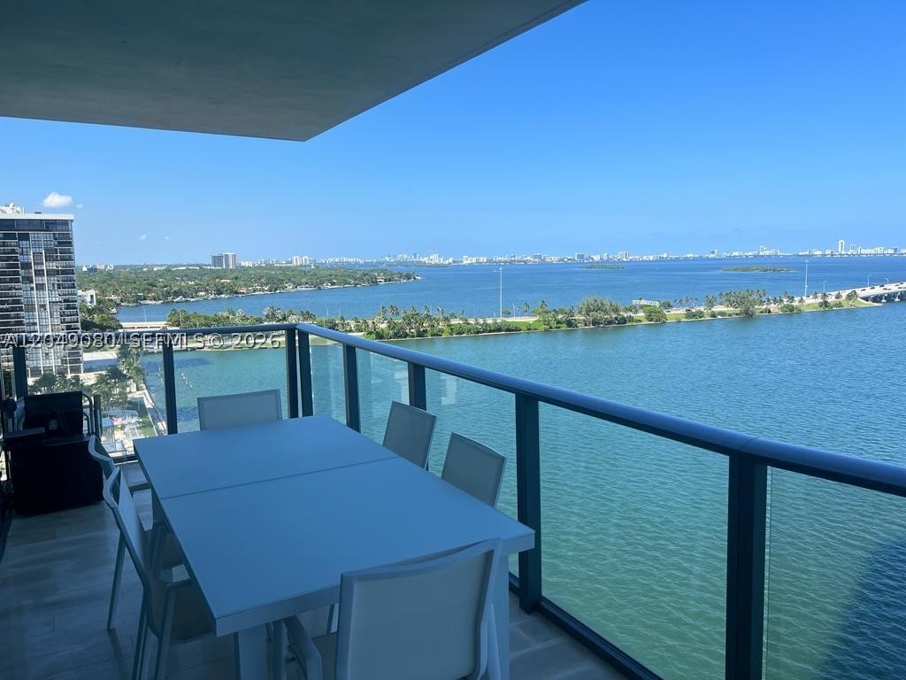 Experience luxury waterfront living in this elegant 18th-floor residence at One Paraiso. 3-bedroom, 3-bath condominium offers approximately 1,634 square feet of interior living space with a private elevator entry, expansive floor-to-ceiling impact glass, and an open-concept layout designed to maximize natural light and showcase stunning Biscayne Bay and city views. The modern chef's kitchen features premium European cabinetry, high-end appliances, and sleek finishes, while the generous primary suite includes a spa-inspired bath and ample closet space. Residents enjoy resort-style amenities including multiple pools, a state-of-the-art fitness center, spa, tennis courts, children's play area, theater, concierge, valet, and 24-hour security, all within minutes of the Design District, Wynwood, Brickell, and Miami Beach. tenant occupied until oct 2026