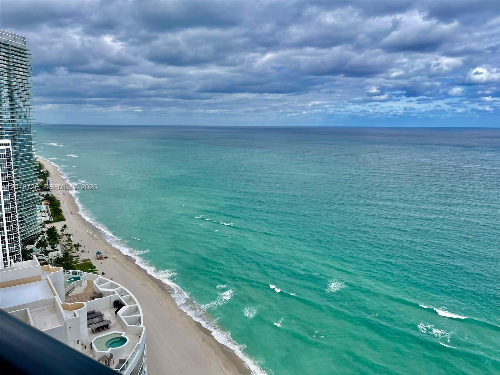 Exceptional in every aspect, this unit is a masterpiece of luxury living with direct ocean frontage. Boasting 4 bedrooms, 3.5 bath, along with a service room with its own bath, plus a versatile Den/Family room.This residence offers a wealth of space for your comfort & convenience with its own private elevator.Step onto the terrace & discover a private pool and summer kitchen, great for relaxation and entertainment. This extraordinary unit goes beyond the ordinary, featuring a private garage & a state-of-the-art robotic car elevator. The amenities are nothing short of 5-star, including a fully-equipped gym, a serene spa, personalized beach service, a private restaurant, theater, virtual golf game, a race car simulator for enthusiasts, and a lounge bar & coffee area for moments of
leisure.
