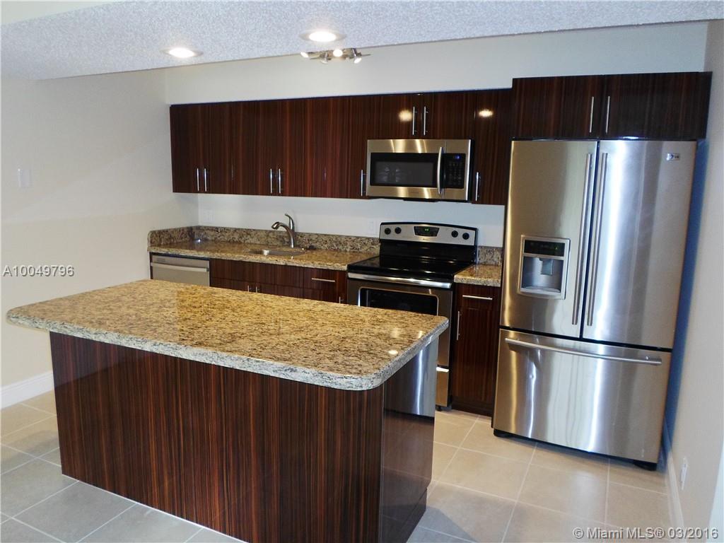 Gorgeous remodeled 1 bed 1 bath unit at Windward Lakes. Huge Modern kitchen with granite counter and island, new cabinets, and stainless steel appliances.  Tile and wood laminate floors. Updated bath with granite counter and new cabinets. Washer/Dryer inside the unit. Your client will fall in love with it. Show and rent today!