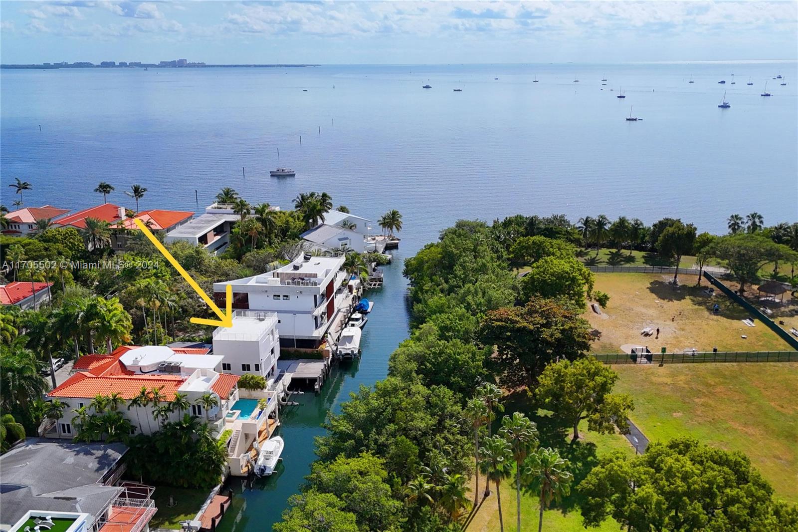With no bridges to the Bay, this newly-renovated home on exclusive Rockerman Road is a boater’s paradise w/ 6 BRs & 4.5 BAs spanning 3,517 SF on a 7,053 SF lot w/ 61’ on the water.  The open kitchen features new appliances & freshly-painted cabinets.  The living & dining areas have lovely views of the water & Kennedy Park across the way.  There are also 2 BRs w/ en-suite baths on the 1st floor, 1 of which could be the primary suite.  The primary suite is located privately on the 3rd floor & includes 2 walk-in closets, BA w/ dual vanities, & separate tub & shower.  The 4th level rooftop terrace enjoys gorgeous vistas! New roof, new impact glass windows & doors, new seawall & dock w/ lift, renovated BAs, easy bay access, all conveniently close to downtown Coconut Grove & downtown Miami!