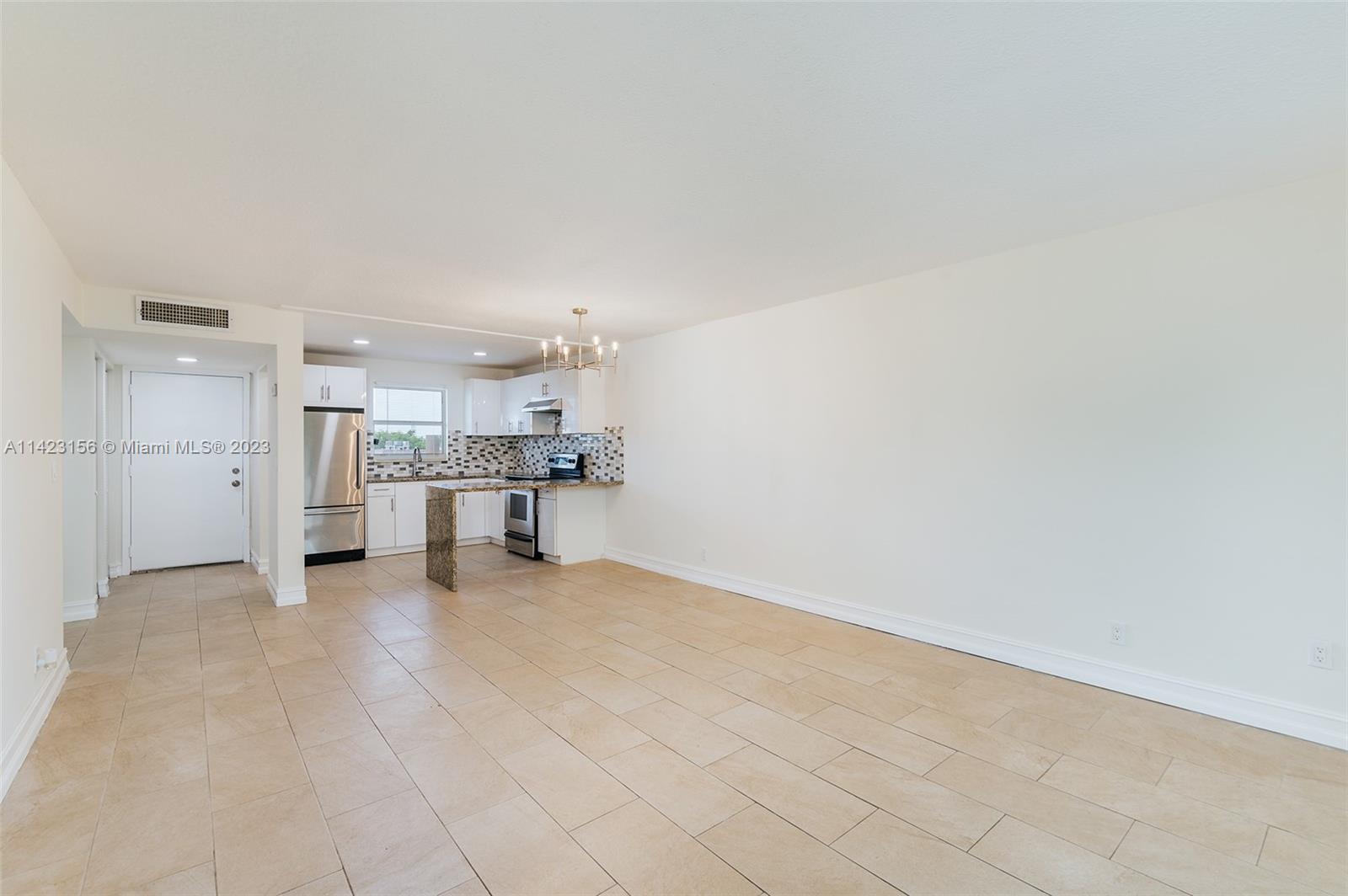 This completely renovated, corner unit condo is ready to move into. The condo has an updated kitchen & bathroom, nice ceramic tile flooring throughout, and fresh paint. The open kitchen features modern, soft-close cabinets, stainless steel appliances, and granite counters. You'll find extra living space in the enclosed balcony with lots of natural light overlooking the canal. Whether you are a year-round or seasonal resident, Lakeside Village offers many activities to keep you busy. The community has 2 pools, an exercise room, shuffleboard, mini putt golf, gas grills, and a clubhouse and auditorium with social events, such as weekly bingo, dances, shows, and movies. Newer tankless water heater and A/C. Laundry on same level as condo. HOA includes water/cable/internet.