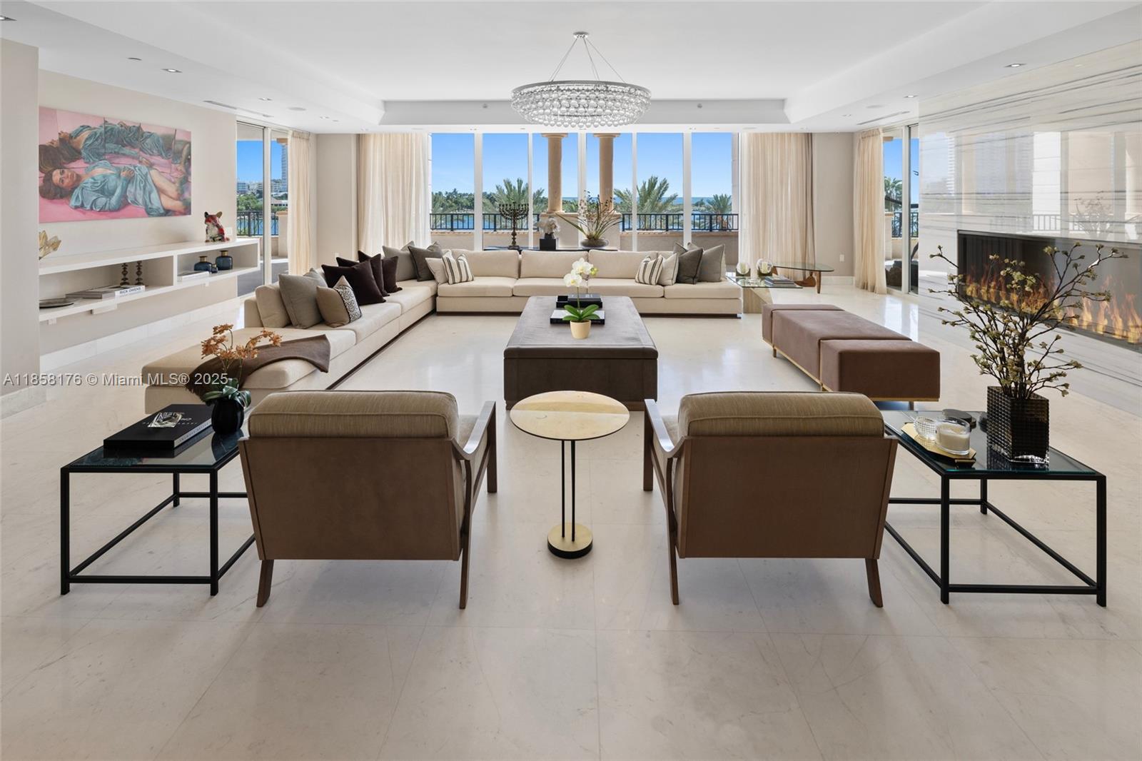 Just steps from the Atlantic and Miami’s vibrancy, Fisher Island offers a lifestyle of wellness and luxury. Commanding the prized center stack of a distinguished address, this 7,025 SF 6BR residence captures sweeping views of South Beach, Government Cut, and the ocean. Expansive living spaces flow effortlessly, featuring a grand master suite with private office and serene water vistas, a cozy family room, and a sprawling terrace ideal for alfresco dining and sunset watching, plus a private garage and ample storage. The building is being modernized w/ an aperitivo lounge, elegant new lobby, and reimagined pool area, elevating world-class island living.