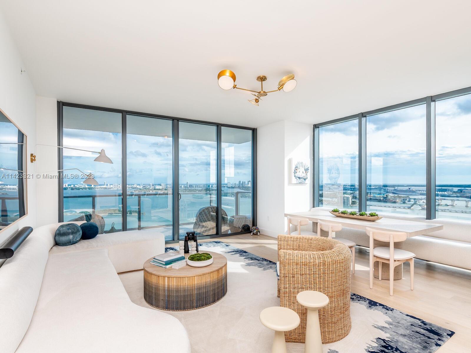 Breathtaking panoramic water and city views from every room of this spectacular Southeast corner 3 bed/4.5 bath + den residence. Boasting a total of 3,100 sq feet of indoor and outdoor living spaces. This designer finished, turnkey residence is featured in the January 2023 issue of Luxe Interior + Designs. European White Oak flooring, custom crafted wine and coffee bar, and intricate millwork compliment the soothing coastal palette of chic furnishings, floor to ceiling windows, wolf appliances, waterworks bath fixtures and more. Located at the edge of Biscayne bay, Elysee is Edgewater's premier luxury resort styled boutique building at the nexus of world class art, design and culture.
