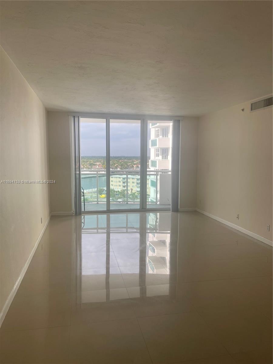 Live the dream South Florida Lifestyle in this priced to sell located directly on the sand residence in Hollywood Beach Watch the boats going by from your balcony with intracoastal view. 1bedroom/1 Bath. Perfect for investors or permanent residents. Updated with tile floors and equipped with new impact glass window in bedroom. Maintenance includes A/C, cable, hot water, internet. Building just passed 50 year recertification. Offers all amenities, beach level swimming pool, cabanas, tiki bar, barbecue grill, state of the art gym, social room, spa, sauna, business center. Centrally located in Hollywood Beach minutes from downtown Hollywood, shopping, restaurants, brand new Publix steps away.