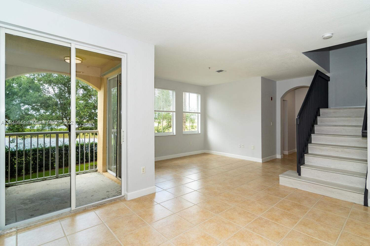 NEWLY REMODELED 2-STORY TOWNHOUSE CONDO IN GATED COMMUNITY.  THIS MODERN HOME FEATURES A LARGE KITCHEN W/ NEW STAINLESS APPLIANCES, GRANITE COUNTERS AND WHITE CABINETS * BRAND NEW BATHROOMS W/ MODERN VANITIES AND PORCELAIN TILE FLOORING AND SHOWERS * NEW LUXURY VINYL PLANK FLOORING ON STAIRS AND ENTIRE 2ND FLOOR * PRIVATE BALCONY OVERLOOKS A BEAUTIFUL LAKE.  COMMUNITY POOL, PLAYGROUND, GYM. CLOSE TO I-75, SHOPPING, RESTAURANTS, PEMBROKE GARDENS AND CITY PARKS.