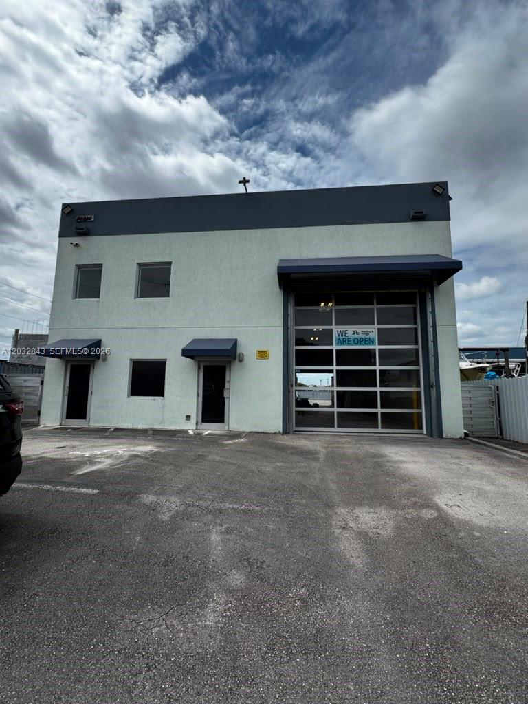 FREESTANDING INDUSTRIAL BUILDING FOR LEASE IN THE HEART OF DORAL (33172) — a true standalone asset, not a shared bay in a multi-tenant park. The 3,232 SF building (2,720 SF ground floor + 512 SF mezzanine) sits on a fully fenced 7,022 SF lot with a SECURE GATED YARD and private gated parking, giving your client total control, privacy and real street presence on NW 22 St — ideal for an operator that needs to store vehicles, equipment or materials securely on site.
The ground floor offers an open warehouse with a grade-level drive-in door, a showroom / front-desk reception, a private office and two restrooms (one full with shower). The 512 SF mezzanine adds flexible storage overlooking the floor. CBS block construction (Type II-B), 24' to parapet.
Set in Doral's prime industrial corridor — one of South Florida's most in-demand business hubs — minutes from Miami International Airport with immediate access to the Palmetto Expressway (SR 826) and the Turnpike, surrounded by established trades, suppliers and logistics businesses. Zoned I-1 Light Industrial; currently a welding facility and suitable for many qualifying uses: fabrication, machine shops, contractors with a yard, auto service, suppliers and light industrial (tenant to obtain its own Certificate of Use).
Offered at $10,000/mo NNN, 3-month deposit. Industrial use only. Freestanding buildings with their own yard rarely come available here — showings by appointment, co-broke welcome. Schedule a private tour today