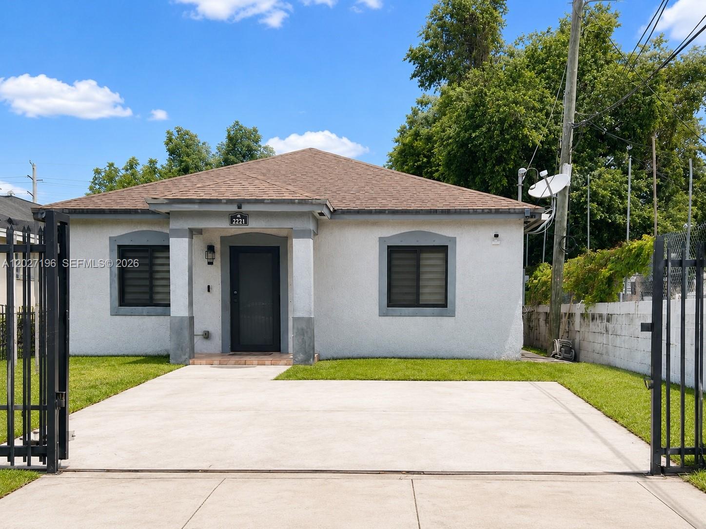Centrally located in the heart of Miami, this well-kept 3-bedroom, 2-bathroom home sits on a private 5,640 sq. ft. lot and offers the perfect blend of comfort and security. The property features premium upgrades, including full hurricane impact windows and doors installed in 2024, and a brand-new AC system installed just last year. For ultimate peace of mind, the property is fully enclosed by an electric iron gate with secure key access and features a front entrance security camera. The spacious driveway comfortably accommodates two vehicles. Offering a highly functional layout, a generous yard, and an unbeatable location near major highways, shopping, dining, schools, and public transportation, this home presents an incredible opportunity for both owner-occupants and savvy investors alike.