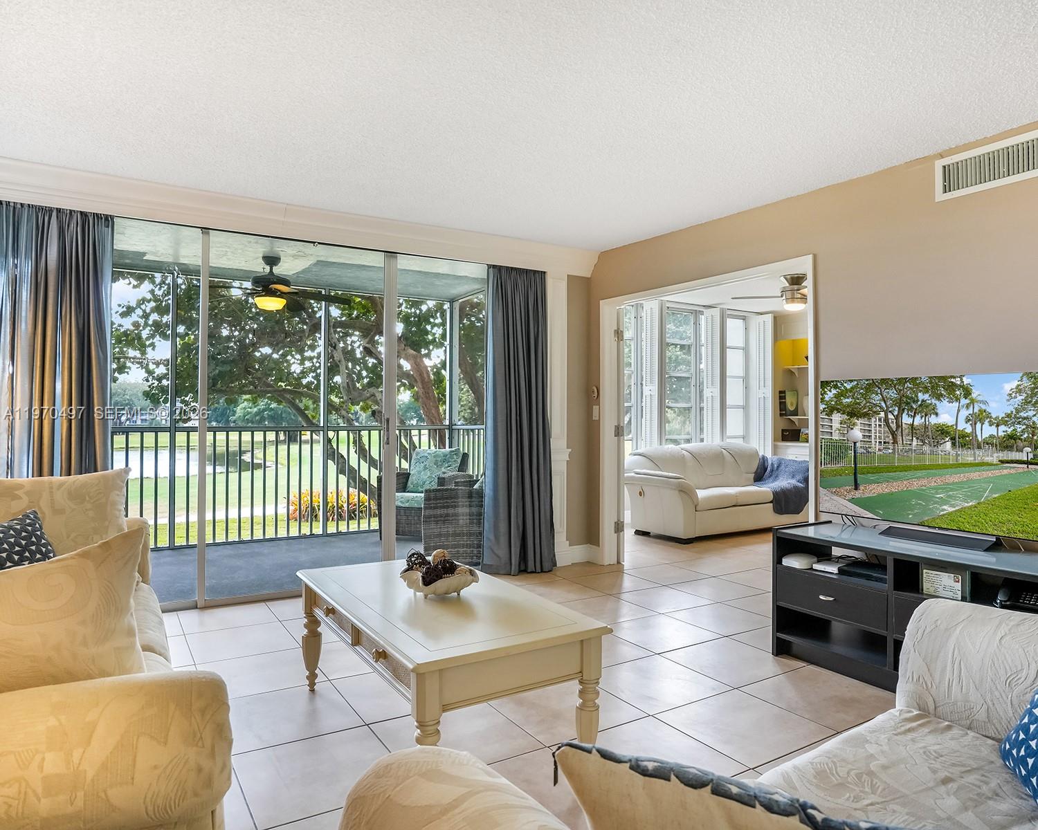 Spacious and well-maintained 2-bedroom, 2-bath condo in a desirable Pompano Beach community. This bright unit features a functional layout with a large living and dining area, ideal for both everyday living and entertaining. The kitchen offers plenty of cabinet space and opens nicely to the main living area.

The primary bedroom includes generous closet space and a private ensuite bathroom. Enjoy peaceful garden and golf course views from your screened balcony — perfect for relaxing mornings or quiet evenings.

Located in a quiet, well-kept community with amenities such as a heated pool and clubhouse. Conveniently close to shopping, restaurants, major highways, and just a short drive to the beach.

Great opportunity for a primary residence, vacation home, or investment property. Priced to sell — schedule your showing today.