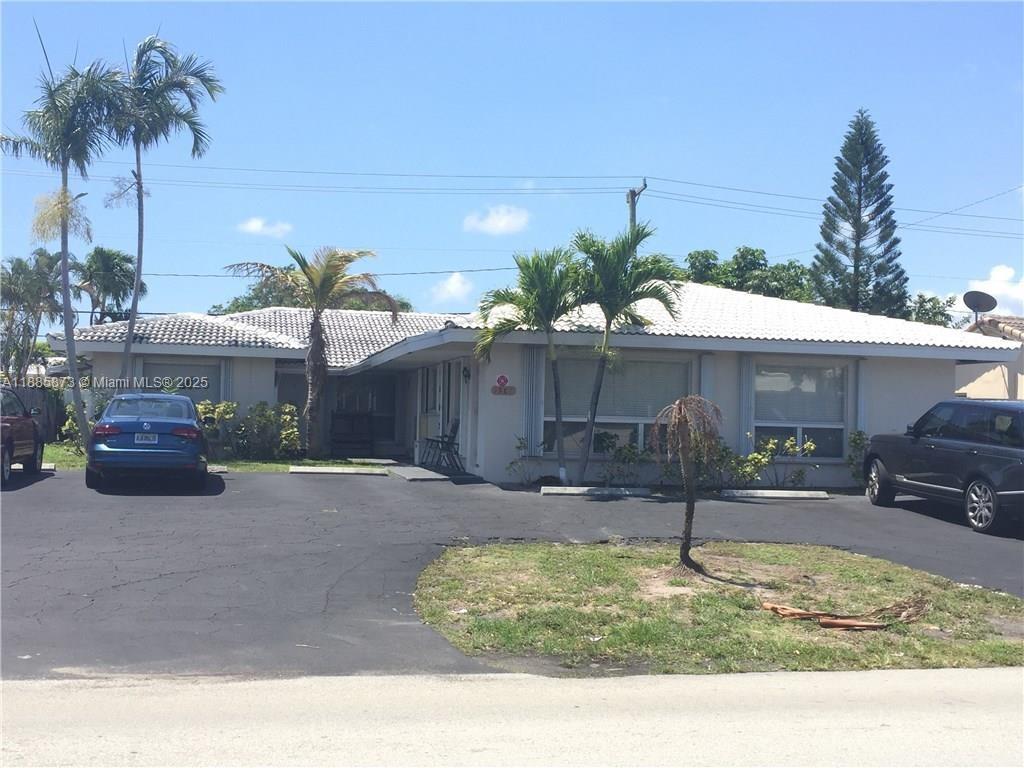 Coral Ridge Isles area Tri-Plex - 2/2, 2/1, 1/1. Great opportunity for redevelopment or continued rental income opportunity. AIRBNB opportunity.  New roof, Hurricane Shutters. Each unit has their own yard and 2 parking spaces.