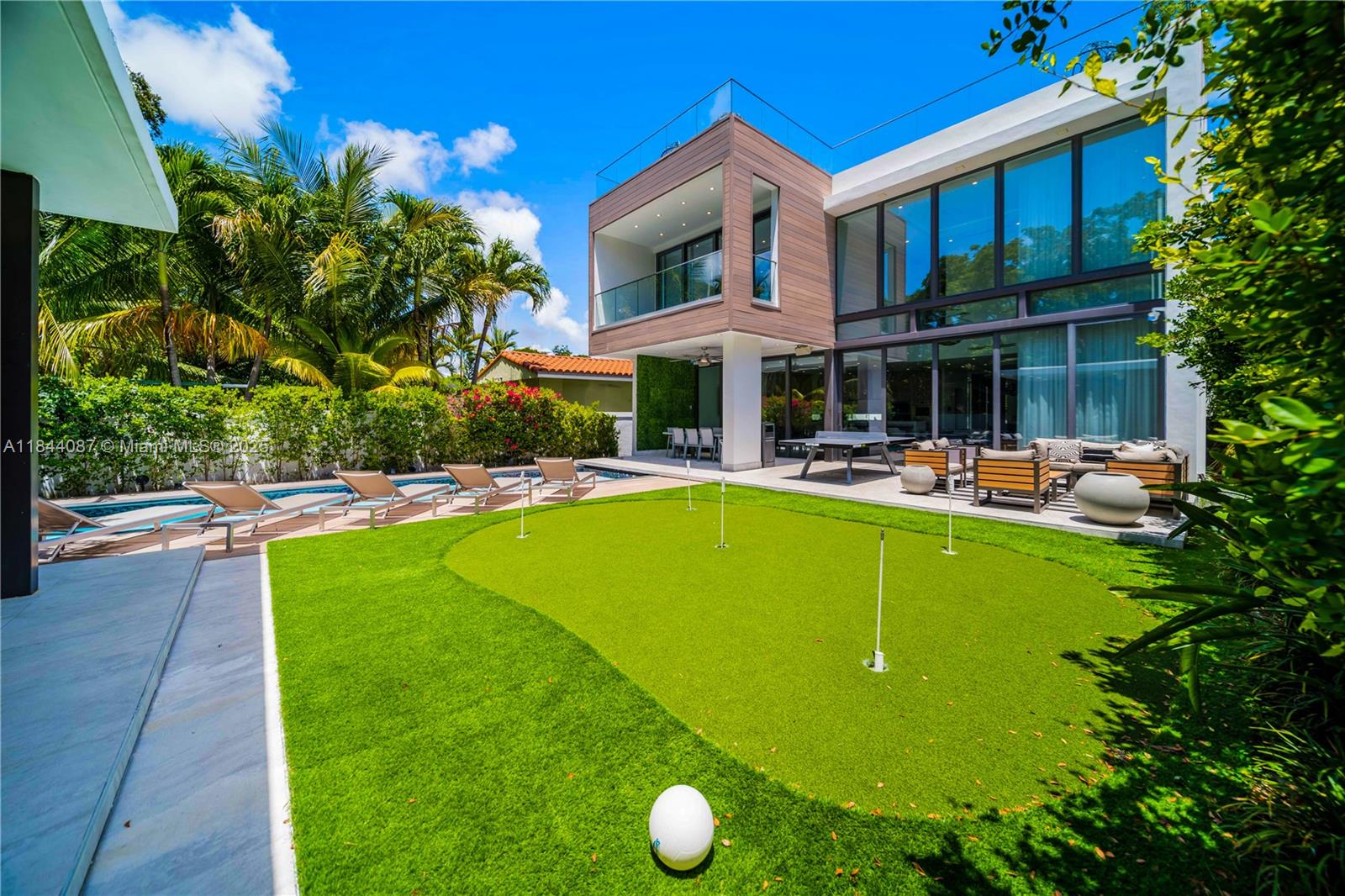 Striking tri-level residence completed in 2019, seamlessly combining modern innovation, privacy, and resort-style luxury in the heart of Miami. Enclosed behind a secure entry, the home features 4 en-suite bedrooms + media room, 4.5 bathrooms, and a sleek glass elevator servicing all three levels. Soaring 21-foot floor-to-ceiling impact windows flood the double-height living spaces with natural light seamlessly connecting the outdoors. The chef’s kitchen is outfitted with Sub-Zero / Wolf appliances and custom Italian cabinetry. Additional upgrades include a full smart home system, a 24kW Generac gas generator, and designer lighting throughout. Outdoors, enjoy a saltwater pool with automated cover, a summer kitchen and rooftop escape with breathtaking city views of Brickell. Superb Location.
