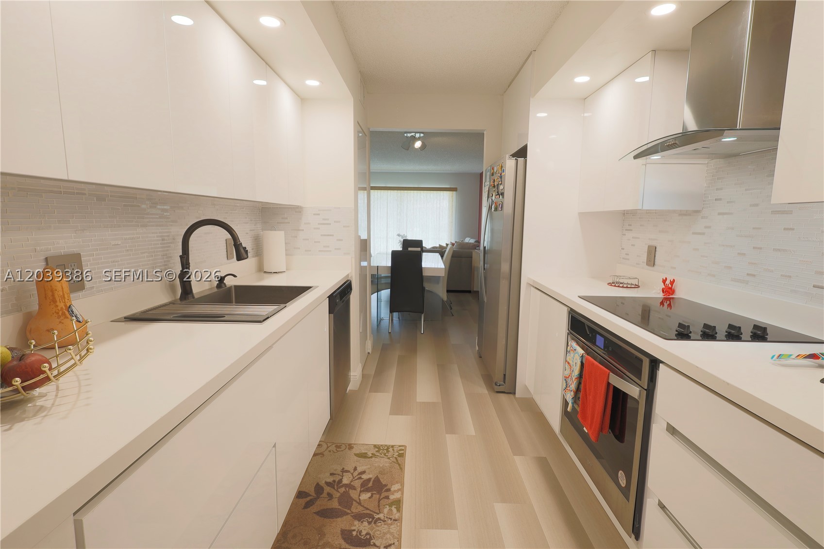 PRIME LOCATION & RESORT-STYLE COMFORT IN CENTURY VILLAGE, PEMBROKE PINES! This fully modernized first-floor condo offers 1,000 sq. ft. of turn-key living space with no stairs or elevators required. The unit features 2 spacious bedrooms, 2 sophisticated bathrooms, and a designer kitchen equipped with custom cabinetry and stainless steel appliances. Enjoy a peaceful and secure environment tailored exclusively for adults 55+. The community boasts premium amenities, including a swimming pool, private theater, weekly activities, 24-hour security, and a resident courtesy shuttle bus. Living here is synonymous with convenience and exclusivity. This is an exceptional opportunity for both low-maintenance living or a long-term investment!
