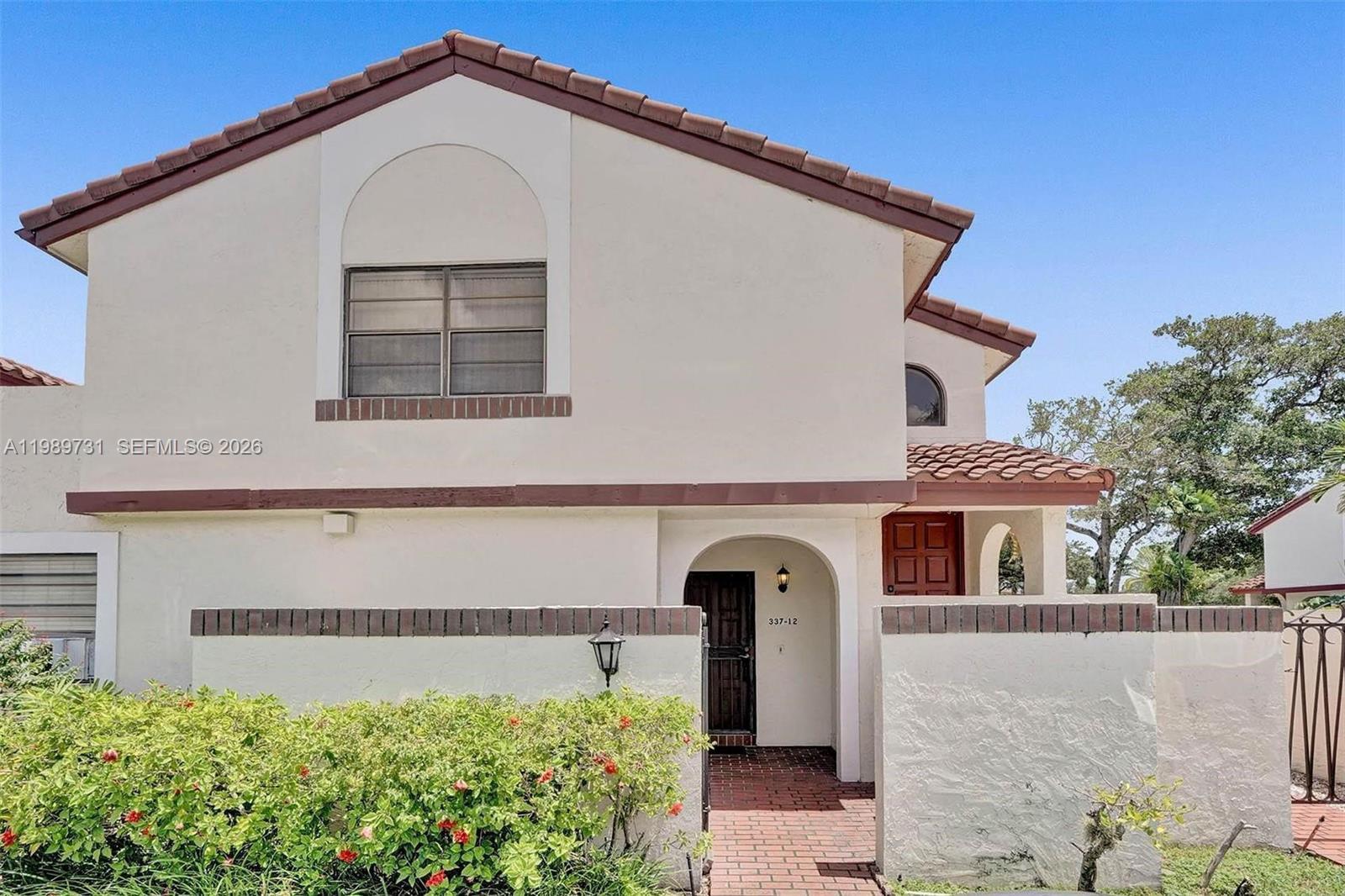 Please call listing agent for appointment.
A exceptionally spacious one-level with 1,715 sq ft of living area. Very easy to turn into a 3/2 by just flipping a closet wall. A charming villa style condo with a true split floor plan, where bedrooms are positioned on opposite sides of the unit, with private entrance, separated by the main living areas. This layout provides a high level of privacy, making it ideal for guests, in laws or roommates. Great interior space, the layout includes a large living area that can easily accommodate a home office or additional seating, along with a laundry room and additional storage in the backyard for added convenience. This is a corner unit with large backyard wrapping around the unit. Lots abundant natural light throughout creating a strong indoor-outdoor feel with a roofed / screened gallery adding significant usable space. Property requires some updates, including AC replacement and is priced accordingly. Conveniently located, just 4 miles from Aventura Mall and 3 miles from Hard Rock Stadium. Sold As is. Buyer to verify all information. Parking allows 2 cars per unit. AirBNB NOT ALLOWED in the community.