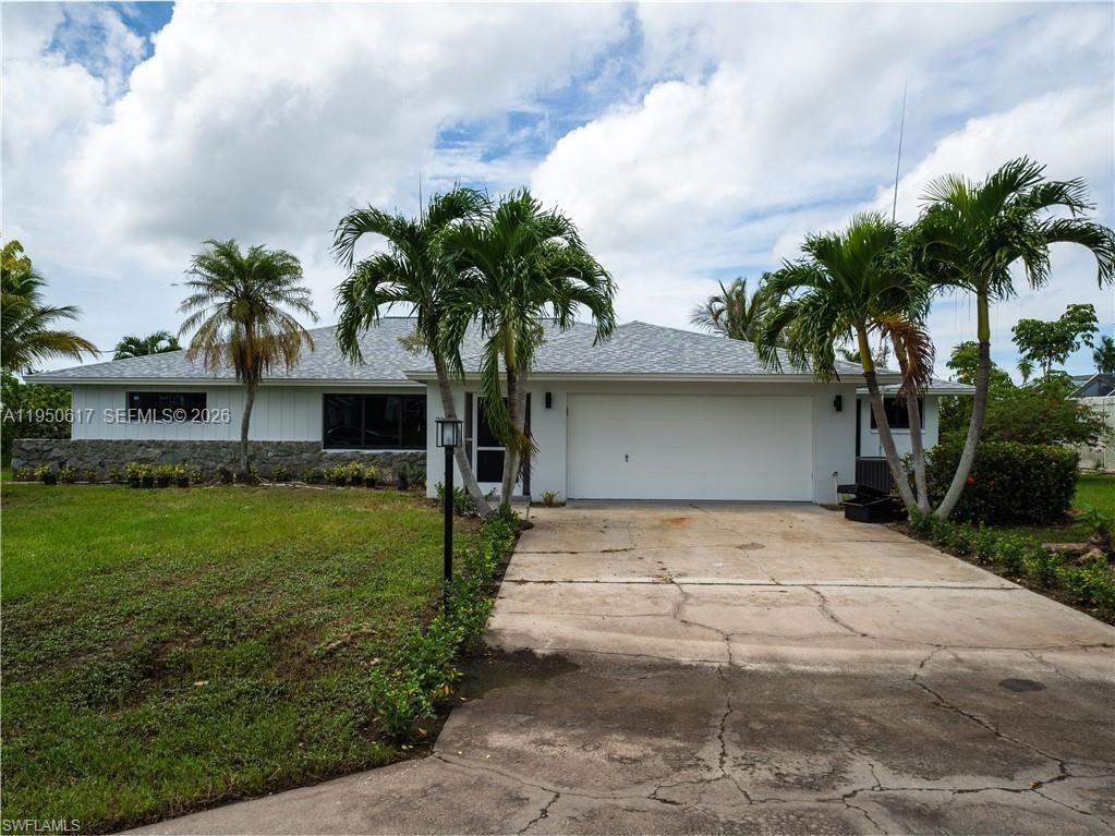 Direct Gulf Access! Experience refined waterfront living in this exquisitely updated 3-bedroom, 2-bath residence offering 2,086 total square feet and a spacious 2-car garage. Tucked away on a private cul-de-sac, this exceptional home showcases stunning canal views and seamless Gulf access. Elegant plantation shutters grace the interior, while a brand-new roof and beautifully renovated living spaces provide peace of mind and modern comfort. Designed for both relaxation and entertaining, the outdoor oasis features a spectacular pool and expansive entertainment area, ideal for hosting unforgettable gatherings. Boating enthusiasts will appreciate the private boat lift, community boat ramp, and exclusive access to a 7-acre riverfront park. A full sprinkler system completes this meticulously maintained property, offering the ultimate blend of luxury, privacy, and waterfront lifestyle.