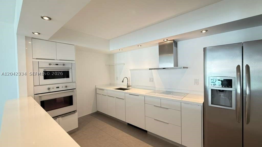 REMODELED AND PRICED TO SELL! Very spacious 1 bedroom, 1.5 bathroom walking distance to the ocean. Tile flooring throughout. Updated open kitchen. Very large bedroom and walk in closet. Open balcony. Investors are welcome as this unit could be rented right away and allows 6 months rental twice a year. Very solid association with good financials. Great amenities include Tennis court, heated pool, BBQ area, social room, modern large gym. 5 min walk to the beach, A+ K-8 school, close to world renowned Aventura Mall. Common laundry room is on every floor. HOA includes cable, internet, water, sewer & pest control. Great opportunity!