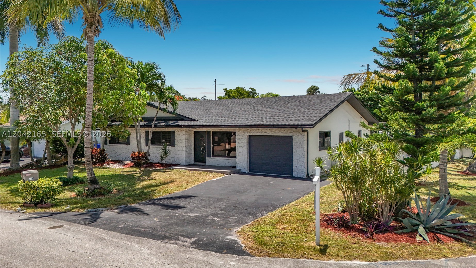 Beautifully updated 4-bedroom, 2-bath home situated on an oversized corner lot in desirable Palm Aire Village. Recent improvements include a new roof, fresh interior and exterior paint, new luxury vinyl plank flooring throughout with updated baseboards, a newly installed plumbing sleeve, and new stainless steel appliances. The home also features impact windows and offers a spacious, functional layout ready for its new owners. Conveniently located near major highways, shopping, dining, and schools. Move-in ready and a great opportunity to own a thoughtfully updated home in a well-established neighborhood.