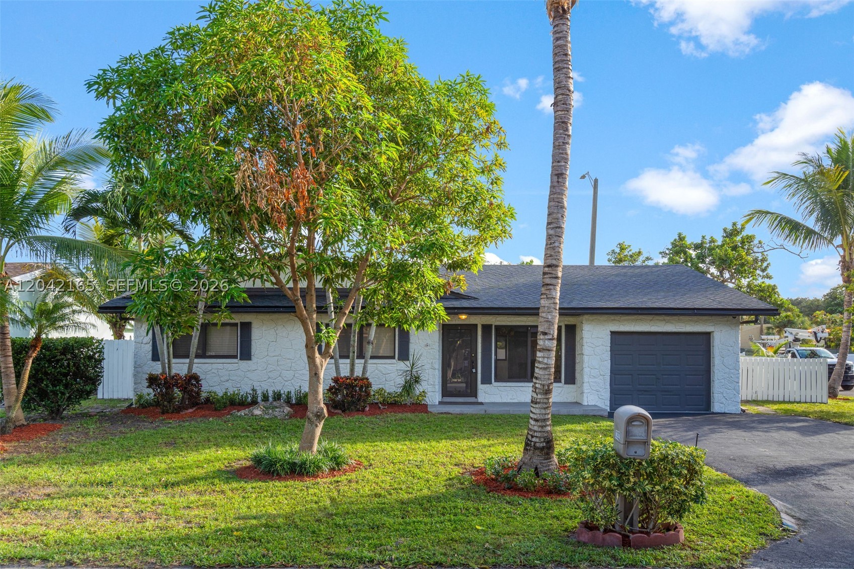 Beautifully updated 4-bedroom, 2-bath home situated on an oversized corner lot in desirable Palm Aire Village. Recent improvements include a new roof, fresh interior and exterior paint, new luxury vinyl plank flooring throughout with updated baseboards, a newly installed plumbing sleeve, and new stainless steel appliances. The home also features impact windows and offers a spacious, functional layout ready for its new owners. Conveniently located near major highways, shopping, dining, and schools. Move-in ready and a great opportunity to own a thoughtfully updated home in a well-established neighborhood.