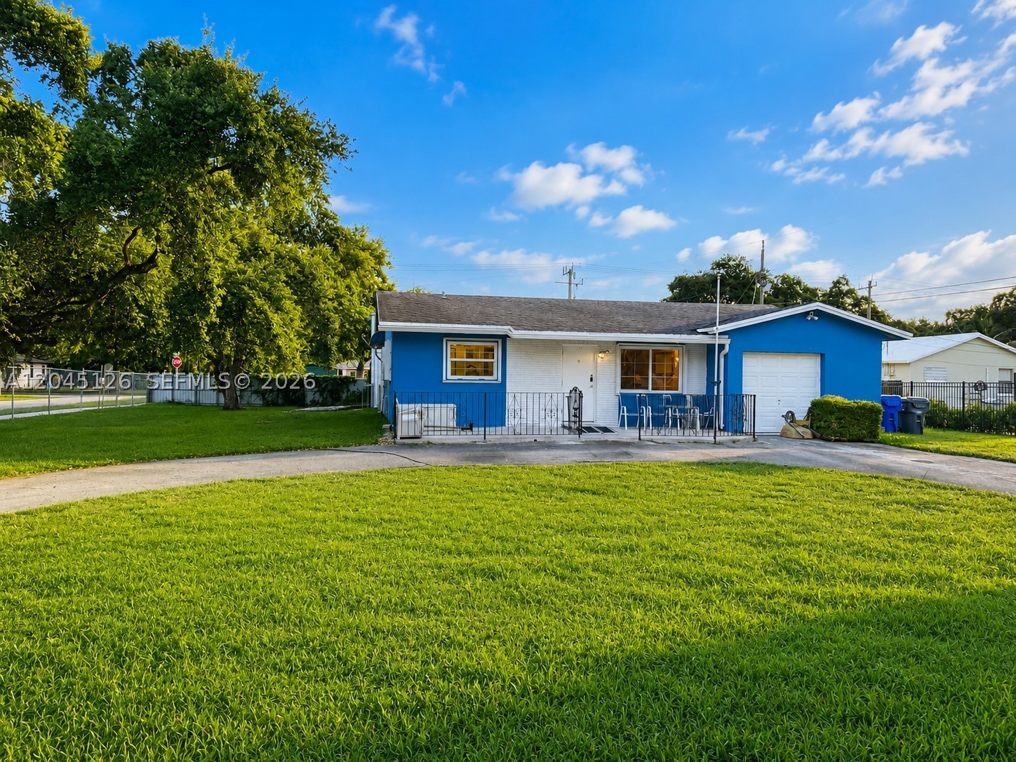 Rare opportunity in Hollywood! Situated on an oversized 15,000+ sq. ft. lot with NO HOA, this unique property offers a 2-bedroom, 2-bath home with an attached 1-car garage, plus an IMPRESSIVE 1,350 sq. ft. detached storage/workshop building. Equipped with its own 2023 A/C and a roll-up garage door, the detached building is perfect for storing an RV, boat, classic cars, equipment, or creating the ultimate workshop, home business, or hobby space. The expansive fenced yard provides abundant parking and endless possibilities. The home features a 2011 roof, 2024 A/C, tankless water heater, impact windows, and accordion shutters for added peace of mind. The property is served by municipal water and a septic system, with the septic cleaned approximately two years ago, offering the convenience of city water without sewer fees. Conveniently located near major highways, shopping, dining, parks, beaches, and airports, this is a rare opportunity to own a property with exceptional space, flexibility, and no HOA restrictions. Opportunities like this with a huge lot, an oversized detached storage building, and no association restrictions are hard to find. Don't miss this exceptional property!  Some photos have been virtually staged to illustrate the property's potential.