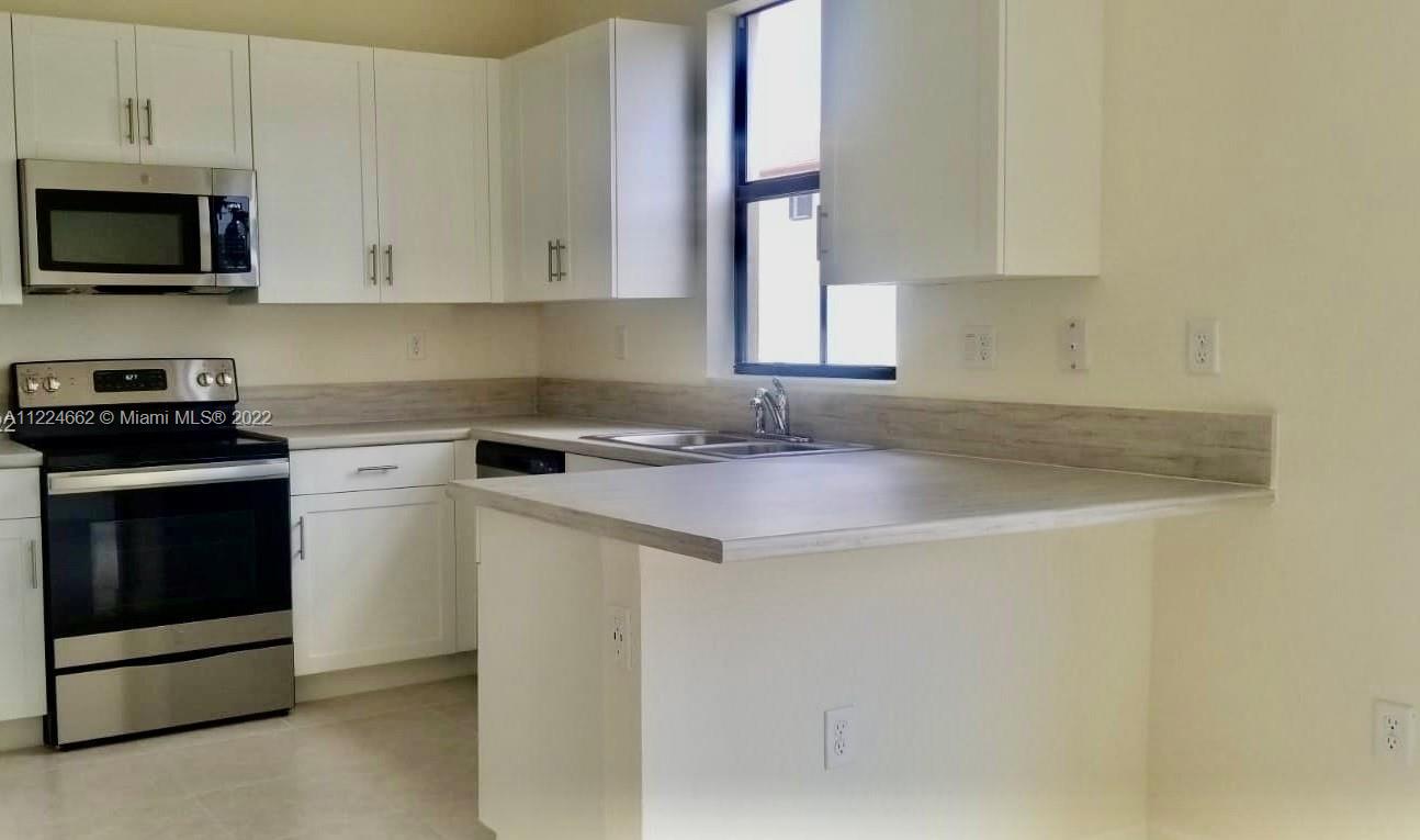 Beautiful and new Townhome located in the New and Privately Gated Community of Aquabella. Built-in 2021 - 3bedrooms 2.5 baths with lots of natural light -  paved driveway, tiles downstairs, beautiful carpeted bedrooms upstairs, stainless steel appliances and big pantry. Smart home: Ring door bell plus WIFI system and A/C Thermostat. Hurricane shutters: easy click on installation.