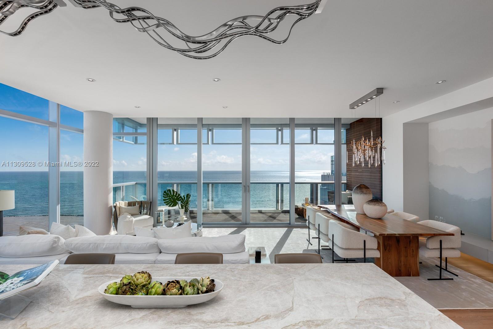 A rare oceanfront, corner retreat with sweeping morning views of the ocean and unforgettable nighttime sunset vistas of Biscayne Bay and the Magic City skyline. 

Welcome to The Miami Beach EDITION, an Ian Schrager concept and John Pawson-designed hotel, and the only flow-through 2 bedroom/2.5 bathroom. Upgraded stone work and feature wall, teak floors, creative lighting scheme, and custom closets throughout. Custom, open design with floor-to-ceiling windows and sliding doors, Bulthaup kitchen with cantilevered concrete bench & millwork. 

The EDITION features 24-hour 5-star resort amenities such as the world-renowned Jean Georges restaurant Matador Room, indoor and pool bars, a private beach, an indoor and outdoor cafe area, room service, a bowling alley, and a skating rink.