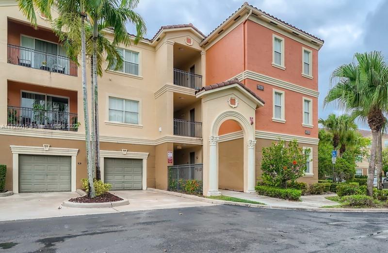 Welcome to your beautiful 2 bedroom, 2 bathroom condo in the beautiful El-Ad Villaggio Condominiums complex! The unit welcomes you with a ground floor entrance that leads you straight into the living area that opens to the dining area and kitchen. The kitchen boasts white cabinets, durable countertops, and ample storage. Make your way to the spacious primary bedroom that comes complete with generous closet space and an en suite bathroom. You will find a covered patio off the living space and the primary bedroom where you can enjoy your morning coffee or admire the sunset. The complex is a gated community, including an incredible clubhouse with a pool, basketball courts, fitness center, and much more!