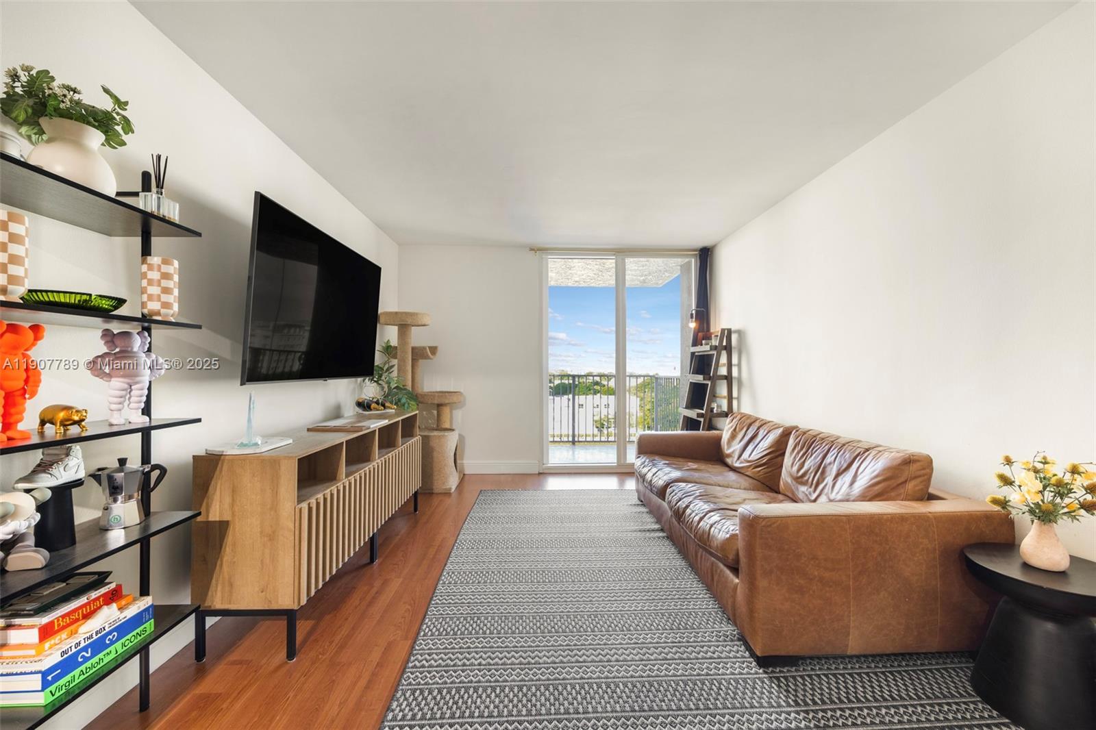 Sleek city living meets unmatched convenience in this updated 2-bed residence at The Madison Downtown. Enjoy expansive, unobstructed views from a spacious layout featuring built-in closets and wood floors. Just a 2-minute stroll to Brightline and Metrorail, and a 5-minute walk to the vibrant energy of Park West’s top restaurants, bars, and shops—Earls, Lucky Strike, Serafina, and more. Includes one assigned parking space plus guest parking. Well-maintained building with strong reserves, open balcony, and pet-friendly policy.