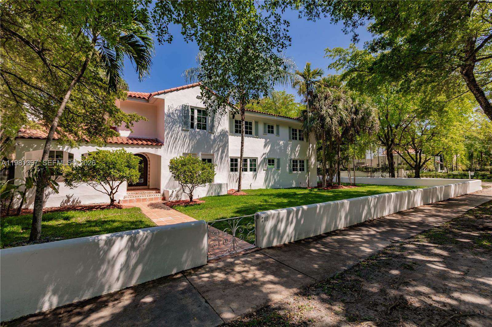 Best value on the market. Quintessential Spanish Colonial Inspired Estate home on a rare expansive 15,000 SF corner lot with Detached Mother-in-Law Suite located along prestigious and picturesque tree lined Alhambra Circle in Coral Gables. This landmark residence showcases timeless architecture and enduring character offering a 2 story 5-bedroom, 3-bath in the Main living, including a convenient first floor bedroom and bath, four ample sized upstairs bedrooms and a 1/1.5 Detached Guest House.  Recent improvements include a new Spanish Tile roof, new AC and ductwork, exterior and interior paint, remodeled ADU, electric blinds, new pool heater and septic.  Key features include hurricane impact windows, a spacious 2-car newly insulated and air-conditioned garage, and pool.  Located one block from the Granada Golf course/greenway and 1.5m to the Biltmore hotel.  With its classic architecture and prime location, this home embodies the timeless sophistication of living in one of the city's most sought after neighborhoods.