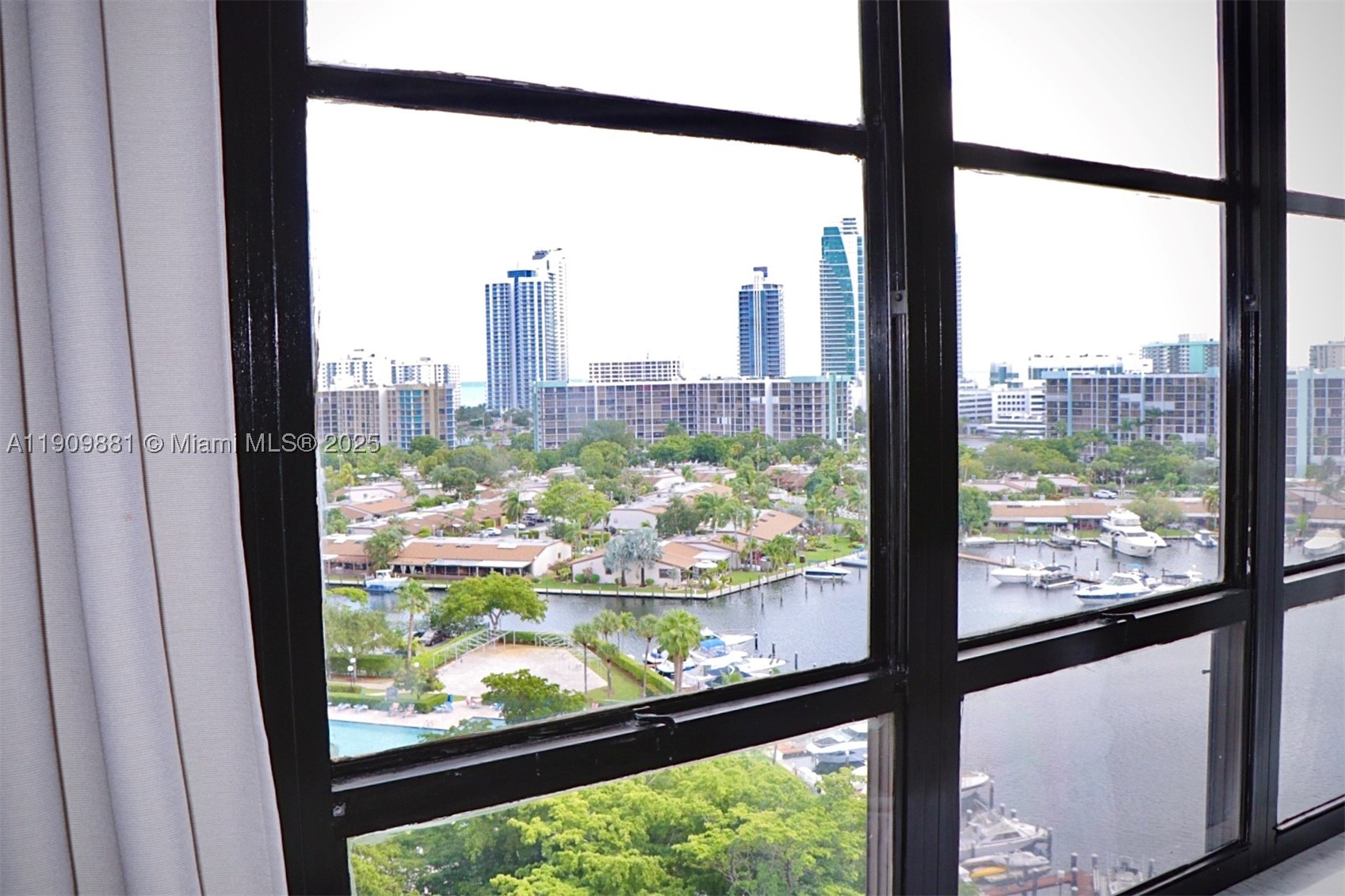Wake up to breathtaking panoramic views of the marina, Intracoastal Waterway, Hallandale skyline and the Atlantic Ocean in the distance from this top-floor residence in the prestigious Olympus Condominium. This bright and well-maintained 1-bedroom, 1.5-bath home features an open-concept kitchen, spacious living and dining areas, a dedicated home office, solid wood interior doors, generous storage and abundant natural light throughout.

Buy with confidence knowing the community has already completed its most significant capital improvements, including a brand-new roof, concrete restoration, façade restoration and seawall reconstruction. Only minor cosmetic improvements remain, including the beautifully renovated secondary courtyard pool nearing completion.

Olympus is one of Hallandale Beach’s premier waterfront communities, offering two heated pools, private marina (boat slips subject to availability), renovated clubhouse, fitness center, tennis and pickleball courts, library, valet, covered parking, 24-hour security and complimentary shuttle service to the beach and shopping.

Ideally located just minutes from Hallandale Beach, Gulfstream Park, Aventura Mall, restaurants and both Fort Lauderdale and Miami airports. A rare opportunity to own one of Olympus’ most desirable top-floor residences. Offered As-Is. Cash Buyers only.