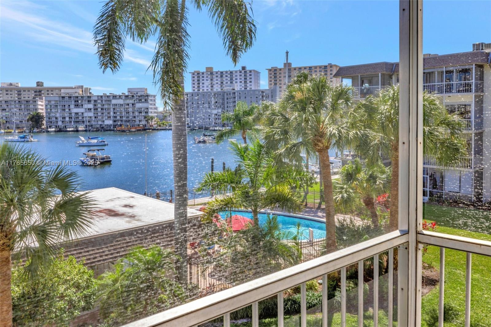 **Million Dollar Direct Bay view from living room & bedroom & balcony** all ages in Yacht Harbor, Owner financing available w/30% down. Boat dockage available, spacious living & dining room, upgraded Bathrooms, lots of storage & natural light facing south, ,assigned parking, heated pool, low hoa fees, no land lease, new Roof 2024. walk right out to beach, shopping, dining, entertainment, close to I-95 and public transportation, beachside. Perfect for end user, or 2nd home.  No Renting first 2 years of ownership. 40 year Certification Passed.