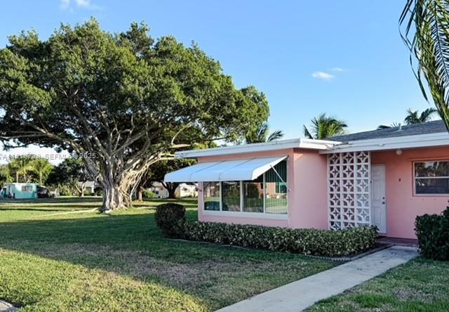 WELCOME TO HIGH POINT IN BOYNTON BEACH! This TURN-KEY property featuring two bedrooms and two full baths offers the perfect blend of comfort and convenience. Corner Unit with a garden view on the greenbelt looking out over mature Banyan trees and beautiful foliage is also situated next to the clubhouse for convenience.  Live a carefree and easy lifestyle in this sought-after community located one mile from the beach. Tile flooring throughout, spacious and airy. The primary bedroom offers a private retreat with an ensuite and a large walk-in closet, plus direct access to the secluded patio overlooking a serene, park-like setting. Enjoy a true sense of privacy with no immediate rear neighbors! For ultimate convenience, the laundry room is located just steps from your door. Perfectly positioned for the snowbird or full-time resident looking to downsize and live an effortless Florida lifestyle. Residents enjoy amenities such as a clubhouse, pool and patio as well as shuffleboard and bocce ball courts. Located one mile from the ocean, this active 55+ community is close enough to all shopping yet tucked away in Boynton Beach!   Come see – won’t last !!