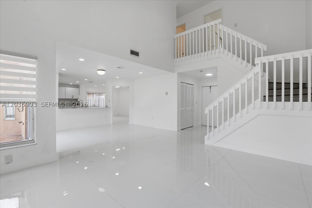 Beautifully remodeled 4-bedroom, 2.5-bath pool home with a 2-car garage in Osprey West. This bright two-story home features high ceilings, abundant natural light, and a spacious layout designed for both everyday living and entertaining. The updated kitchen offers quartz countertops, white cabinetry, modern appliances, and great flow into the main living areas. Upstairs, the primary suite provides a large retreat with walk-in closet and a spa-inspired bath with separate tub and shower. The additional bedrooms are generously sized with excellent storage. Step outside to enjoy the oversized pool and private backyard, perfect for relaxing or hosting guests. Additional highlights include a 2020 roof, new water heater, updated appliances, and a beautifully refreshed interior. Ideally located near Sawgrass Mills, shopping, dining, major roadways, and Sawgrass Elementary School.
