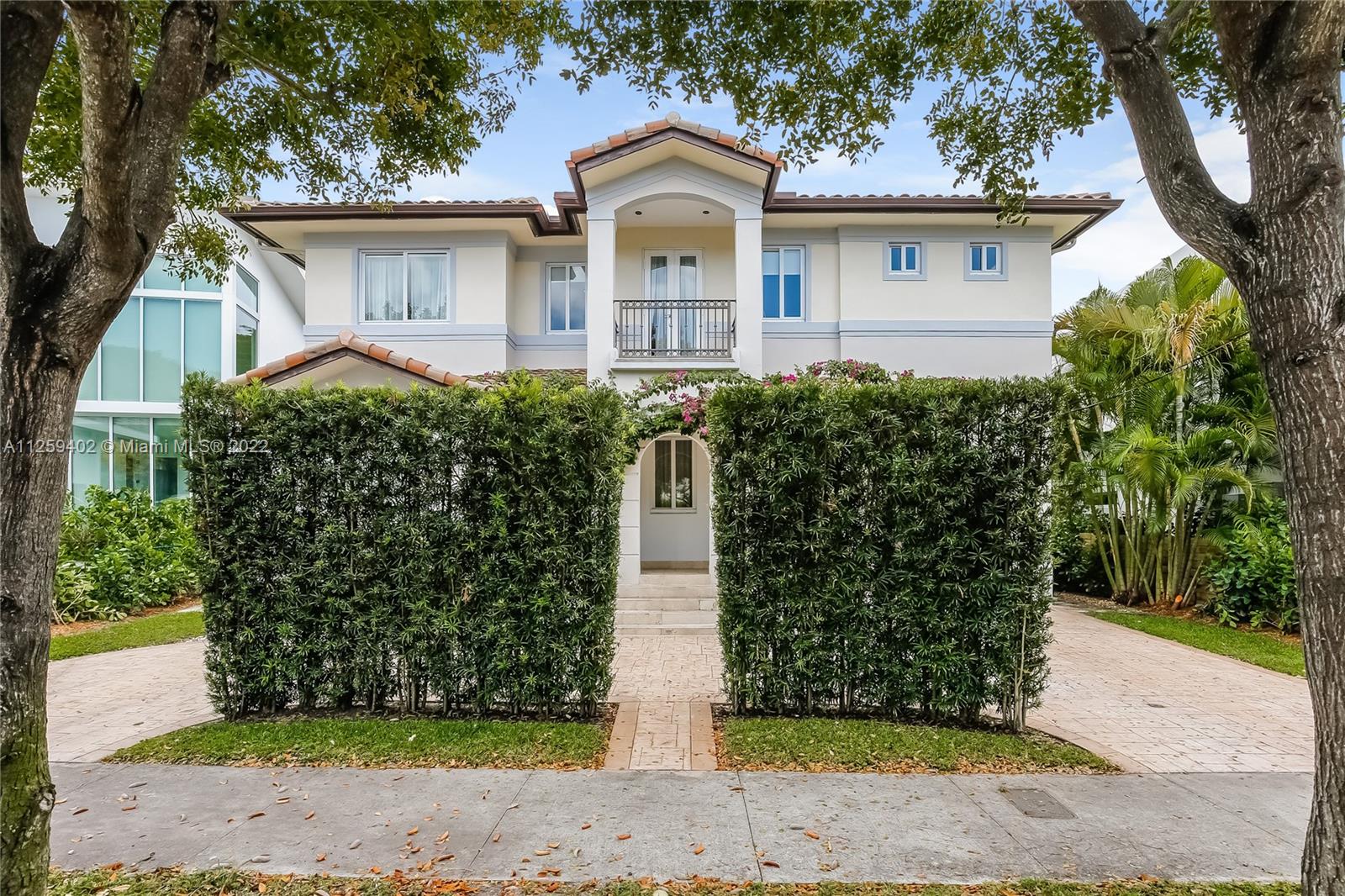 Welcome to N. Bay Road. This Mediterranean style home is newly painted and ready to move in. Built in 2008 with over 4,500 SF of spacious & bright interior space, this home has a modern open layout with 5 bedrooms & 6.5 bathrooms. Wood & stone floors intertwine in an open & expansive layout. The ceiling heights range from 9.5 and 11.5 ft high with double ceilings up to 20ft in entrance & living room. All bedrooms are spacious with high ceilings, en-suite bathrooms & walk in closets. Enjoy a private backyard with a pool surrounded by trees for complete privacy and serenity. Impact windows & recessed lighting throughout, recessed music speakers in social areas & pool porch, alarm and camera system at entrance. Available and ready to show!