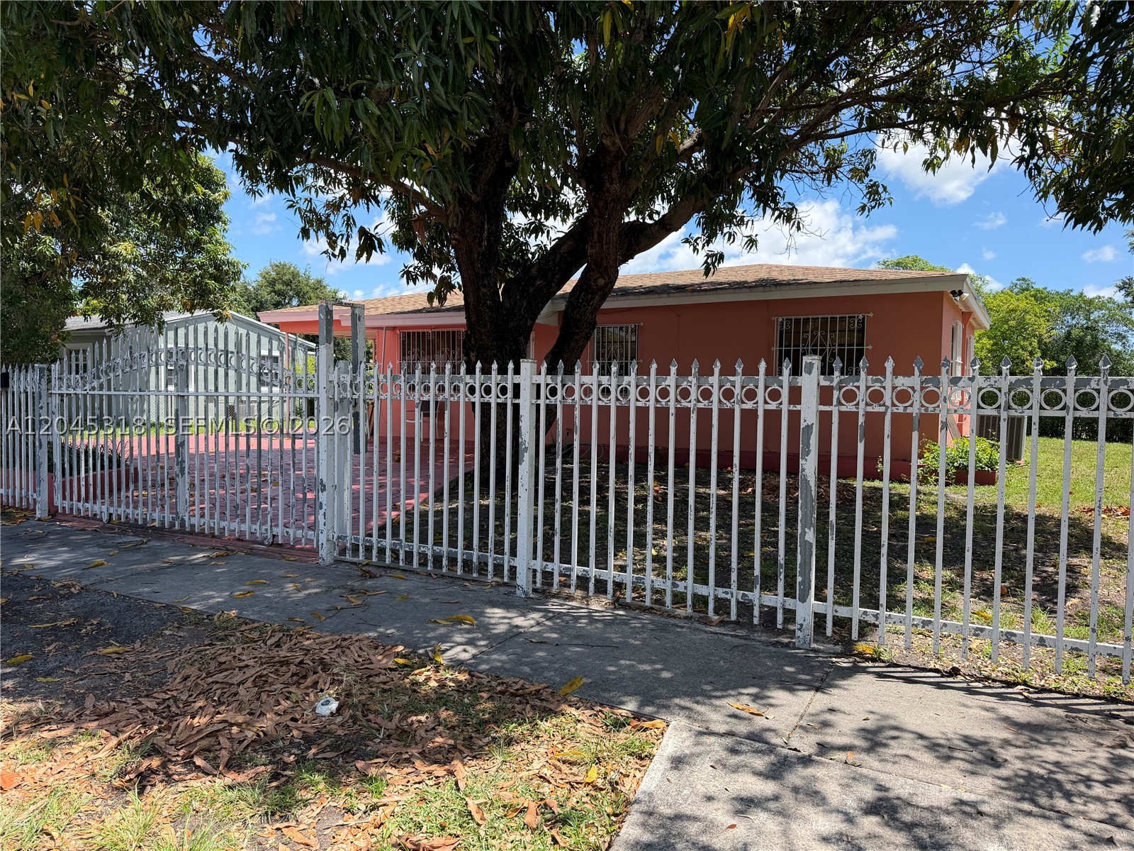 Spacious 4-bedroom, 2-bath home available for immediate occupancy; August 1, 2026. Situated on a desirable corner lot, this property offers an abundance of yard space with several mature mango trees and a variety of fruit trees throughout, creating a beautiful outdoor setting. Please note that the attached efficiency is already rented and has a separate occupant. The landlord is motivated and eager to negotiate with well-qualified applicants. Move-in requirements are first month's rent, last month's rent, and a security deposit. Don't miss this wonderful rental opportunity!