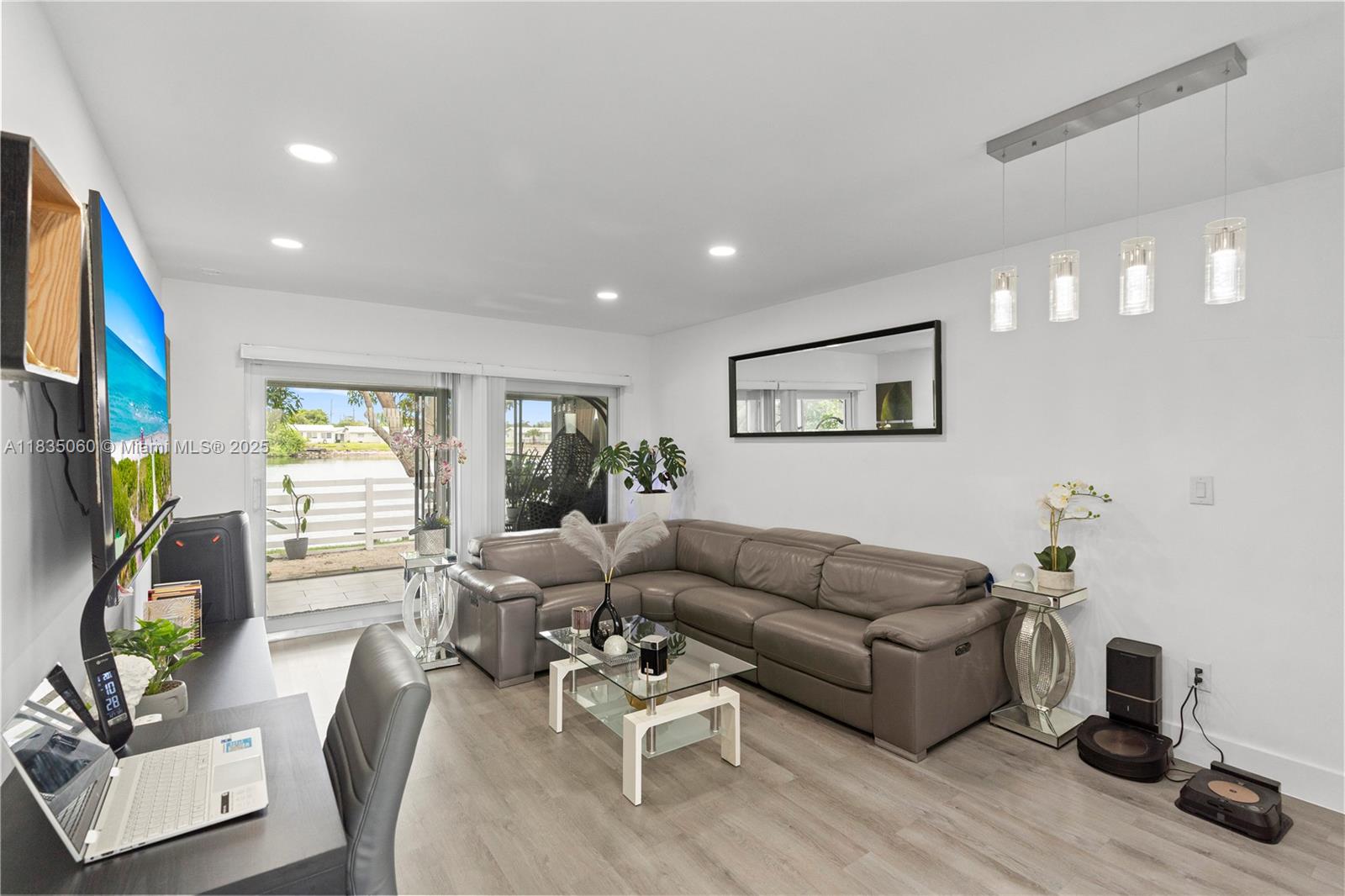 Looking for the perfect blend of comfort, style and affordability? Look no further! This beautifully renovated 2 bedroom 1 bathroom waterfront villa is truly a hidden gem! This home features newly installed hurricane impact windows and doors (2024), a newly renovated kitchen equipped with stainless steel appliances, quartz countertops and shaker cabinets, newly installed vinyl wood flooring, fresh paint, newer water heater and ac (2017). The backyard is a tropical oasis complete with a breath taking lakeview as well as mango trees providing prime relaxation and perfect for entertaining. This home is located just steps away from the newly renovated Caporella Park. Schedule your showing today!