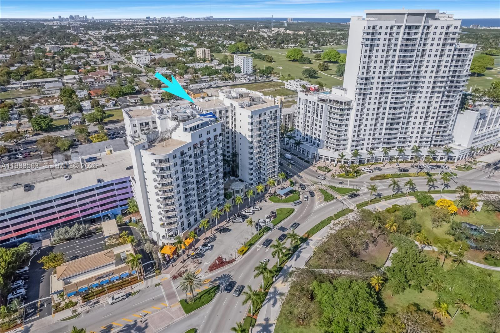 PRICED TO SELL. BEST VIEW IN THE BUILDING! Experience elevated urban living in this upgraded residence at Radius Condominium in the heart of Downtown Hollywood. This unit features wood and tile flooring throughout, a modern kitchen with granite countertops and stainless steel appliances, in-unit washer and dryer, and a tankless water heater. Enjoy tall ceilings, a spacious bathroom with hot tub and separate shower, and beautiful views overlooking ArtsPark with partial ocean views. Radius offers resort-style amenities including a rooftop pool, fitness center, spa/sauna, theater room, business center, 24-hour security, and valet. Prime location within walking distance to shops, restaurants, supermarkets, and just minutes to Hollywood Beach and Boardwalk.