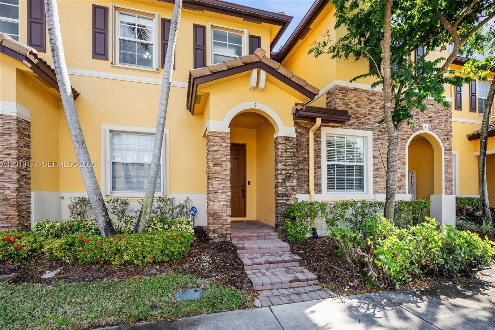 This meticulously maintained 2-bed, 2.5-bath townhouse in The Shores at Lakes by the Bay shows true owner pride. The first floor features tile flooring and a remodeled half bath, while the second floor has Laminate floors. Enjoy new stainless-steel kitchen appliances and a brand-new A/C Unit, zebra blinds, and accordion hurricane shutters throughout. The unit includes two assigned parking spaces right in front and a fully gated backyard. Each bedroom has its own private bathroom and walk-in closet. The community offers excellent amenities, including a pool, gym, and clubhouse, near top-rated schools. Washer/dryer in unit; the community offers Rover security. The HOA fee is $151/month, and the Master Association fee is $50/quarter.