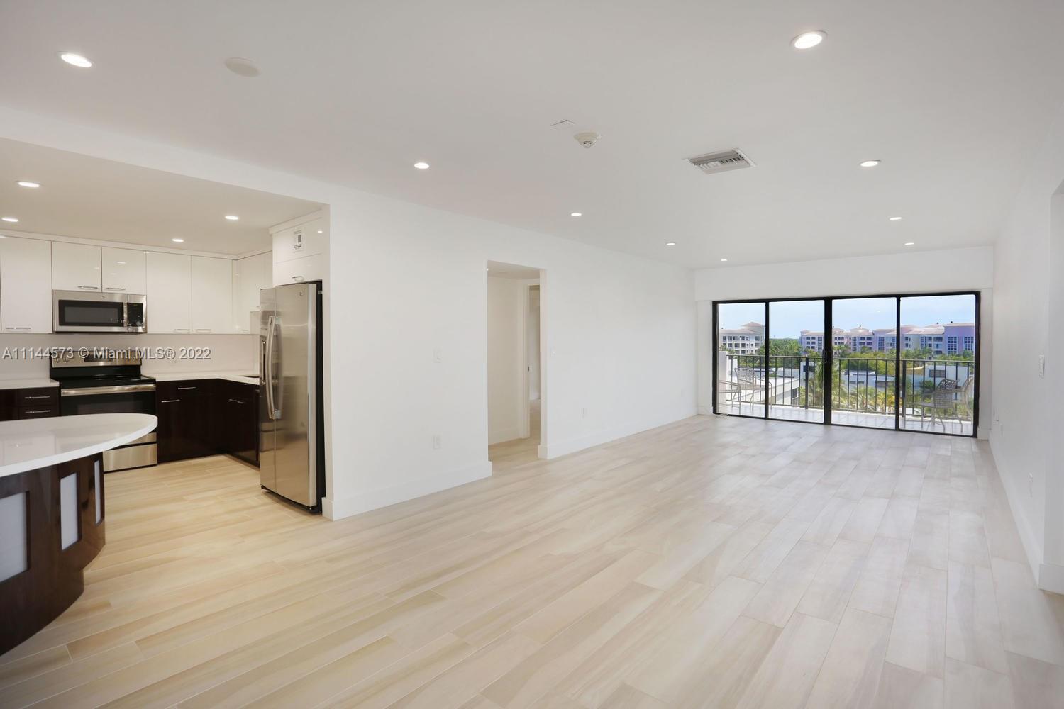 Spacious and bright 2 bedroom/2 bathroom split floor plan unit with south exposure. This apartment has been completely redone with porcelain floors throughout, brand new kitchen, bathrooms, spacious closets and balcony. One assigned covered parking space. Low maintenance building with pool, party room, bike storage, and more. Laundry facilities are offered on each floor. This building has an excellent location: steps from the beach, parks, recreation center and Winn Dixie supermarket. Easy to show.