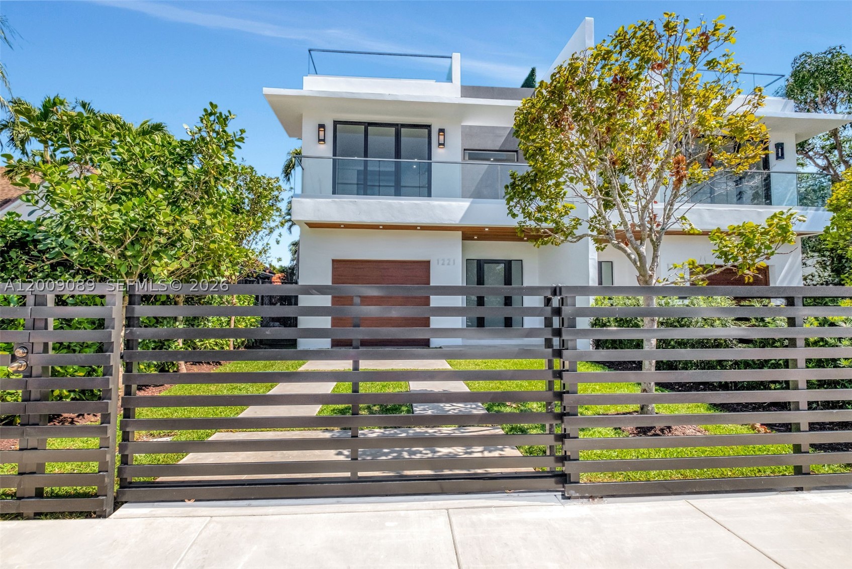 Luxurious Modern City Living at Its Finest. Welcome to this 3-story townhome offering 3,100 SF of lavish living space. This contemporary residence features an open concept, top-of-the-line finishes and gourmet Italian kitchen with open island. The gorgeous outdoor terrace, perfect for entertaining, includes wet bar, built-in gas BBQ, pool and bath. On the 2nd level there are 4 en-suite BRs with convenient laundry center. The spacious master boasts double custom walk-in closets and master spa bath. The 3rd level you'll find for entertaining an expansive rooftop terrace with breathtaking skyline views of downtown Brickell, premium artificial turf throughout and privacy hedge. This luxurious townhome epitomizes modern city living with unparalleled elegance and style. Owner/Agent