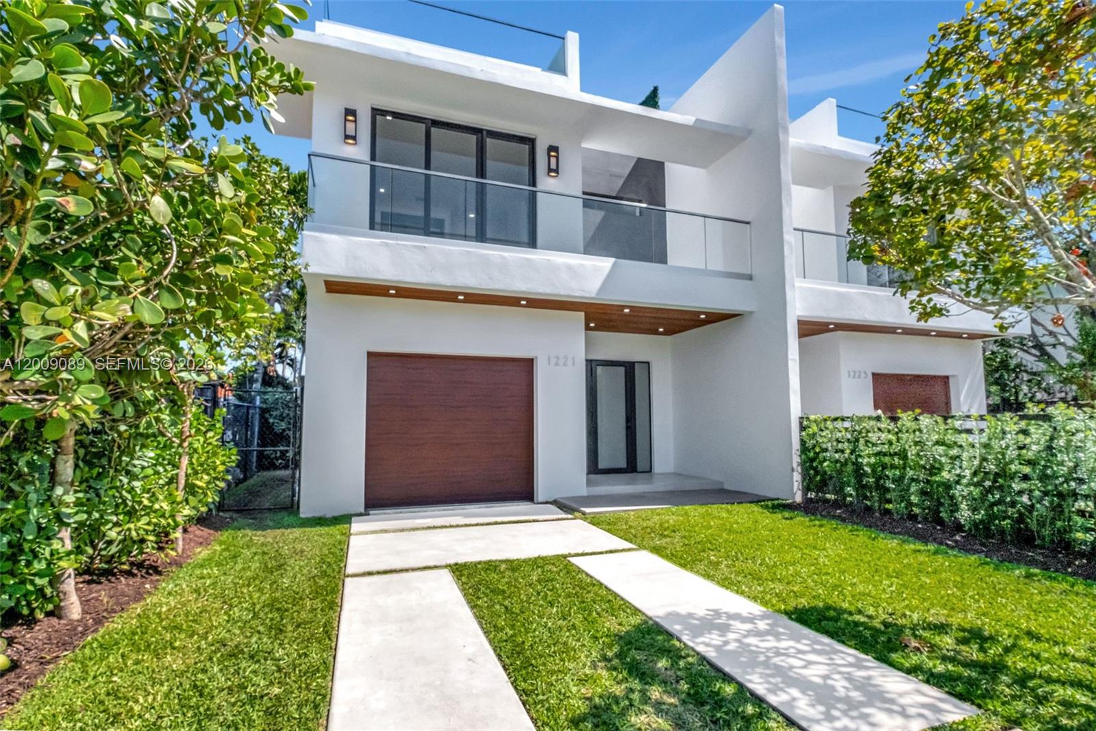 Luxurious Modern City Living at Its Finest. Welcome to this 3-story townhome offering 3,100 SF of lavish living space. This contemporary residence features an open concept, top-of-the-line finishes and gourmet Italian kitchen with open island. The gorgeous outdoor terrace, perfect for entertaining, includes wet bar, built-in gas BBQ, pool and bath. On the 2nd level there are 4 en-suite BRs with convenient laundry center. The spacious master boasts double custom walk-in closets and master spa bath. The 3rd level you'll find for entertaining an expansive rooftop terrace with breathtaking skyline views of downtown Brickell, premium artificial turf throughout and privacy hedge. This luxurious townhome epitomizes modern city living with unparalleled elegance and style. Owner/Agent