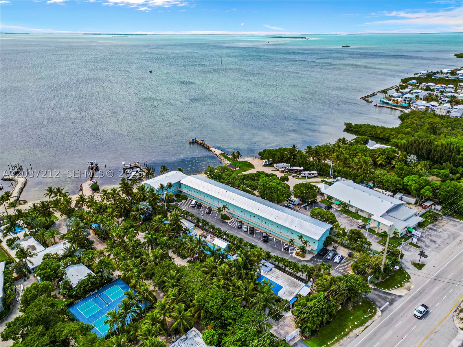 Excellent investment opportunity in the Florida Keys! This updated condo features a 2024 aluminum roof, fresh interior and exterior paint, updated bathrooms, new bedroom carpeting, and two ocean-view balconies. Enjoy private beach access, multiple dock slips, and a prime bayside location near popular restaurants, bars, and local attractions. The special assessment has been paid by the seller. Whether you're looking for a vacation home, rental property, or both, this is your chance to own a piece of paradise in the Fishing Capital of the World.