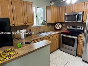 FABULOUS CORNER UNIT SECOND FLOOR WITH SUNNY EXPOSURE.LOCATED STEPS FROM THE POOL,LAKE.PLENTY OF QUEST PARKING SPACES. FRESHLY PAINTED, FULLY TILED THROUGHOUT. KITCHEN WITH MICROWAVE,DISHWASHER,RANGE AND REFRIGERATOR.ALL APPLIANCES WITH 2 YEAR OF USE. LARGE PROVATE SUITE WITH MORNIG LIGHT AND WALK-IN CLOSET. OTHER TWO WELL-SIZED BEDROOMS WITH MORNING LIGHT ARE ON SPLIT PLAN. IN UNIT WASHER AND DRYER WITH 2 YEAR USE. BRAND NEW AIR CONDITIONER 2 YEAR TO USE. GATED COMMUNITY WITH SECURITY,CLUBEHOUSE AND COMMUNITY POOL. ALL BUILDINGS ARE HOMESTEAD SPEEDWAY, SCHOOLS,SHOPPING CENTERS AND PARKS. OCCUPIED BY OWNER. READY TO MUVE IN.NOT SUBJECT TO APPRAISAL.