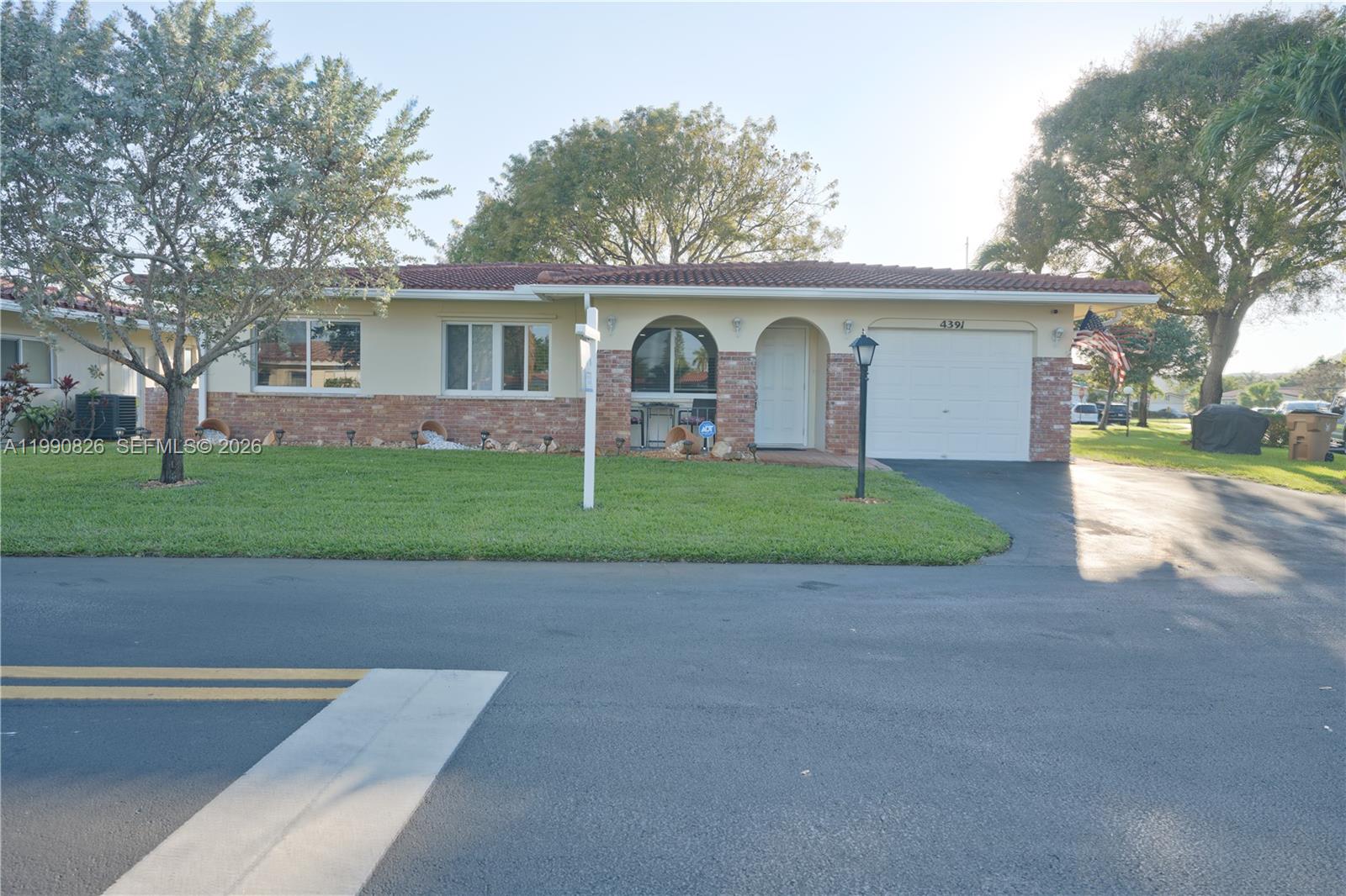 Move-in ready, low maintenance living, quiet, beautiful community, 10 minutes to beaches, close to medical centers, shopping & restaurants and golf courses, fully remodeled kitchen and bathrooms, tile flooring through entire house, laminate in bedrooms, impact windows and doors, corner lot, roof replaced on 2019, LED recessed lighting. This truly is a great buy. The community is well maintained, maintenance includes water and sewer, trash, pressure wash and painting of the house, driveway repairs and landscaping.