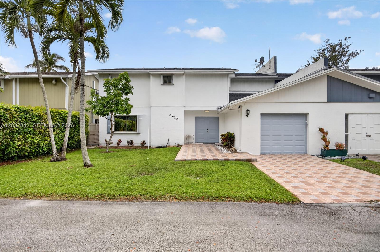 Rare oppotunity in small community of Hidden Lake in Kendall.  Spacious 2 story townhouse  in East Kendall with one car garage on cul-de-sac, Move in condition
New roof installed 2023.  Accordion shutters.  1 bedroom with full bathroom downstairs. 3/2 upstairs. All rooms upstairs open to rear balcony with water views.  Wood laminate floors upstairs and all tiled living areas downstairs.
Covered patio with extended wood deck overlaking lake. Excellent location near Baptist with access to major roads and highways. Low HOA fee covers  lawn and ecological care of the Lake.
