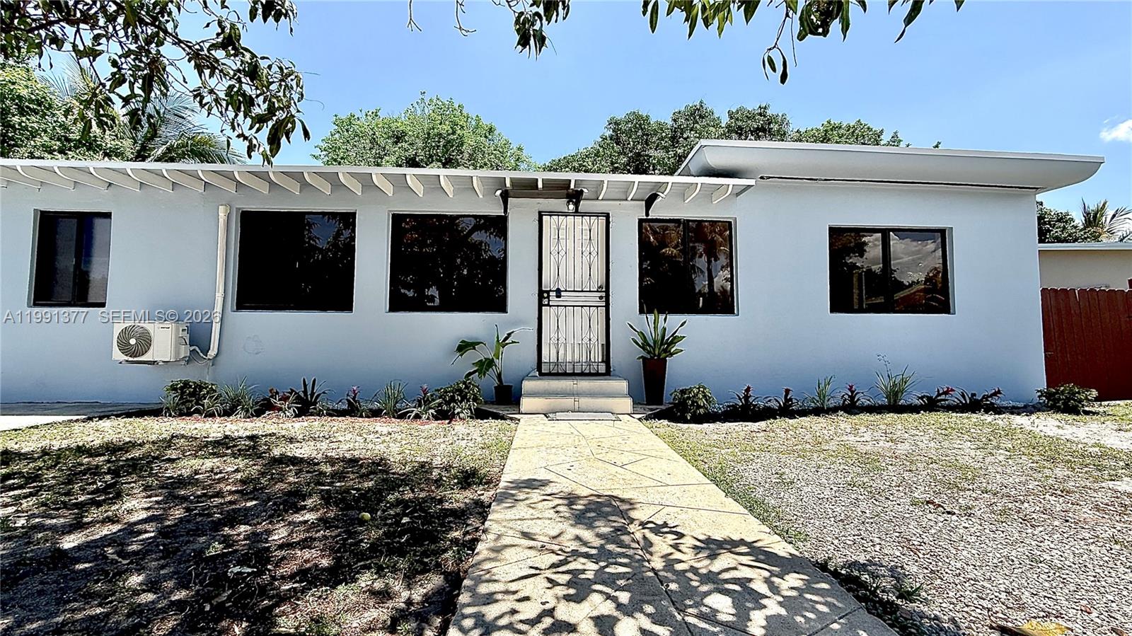 Excellent opportunity to own a home that can accommodate a large family or immediately produce income. Main house is 3 Bed/1 Bath, Impact Windows and has full independant in-law quarters. This property can easily be converted back to a single home to accommodate a large family. Roof is less than five years ago and has a new water heater. Large backyard for the kids to play and walking distance to the Lakeview Elementary School.