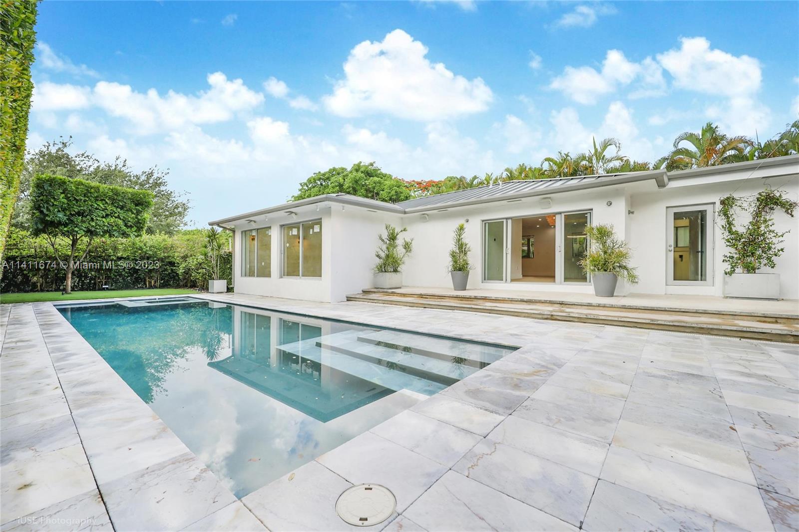 RARE OPPORTUNITY! Fully remodeled Morningside home (4bd/3ba, 2,500 sqf) perfect for families or entertainers. 2023 upgrades include new porcelain floors, custom-built closets and kitchen cabinets, quartzite countertops, and high-end appliances. Primary suite has wrap-around travertine walls, over-sized WIC and en-suite bath with a 63” bathtub. Junior primary suite overlooks the pool and has an en-suite bath with over-sized shower and steam and WIC. 3rd and 4th bedrooms overlook a manicured zen garden. Enjoy the Miami lifestyle with a 40’ x 12’ heated pool with jacuzzi and marble deck surrounded by manicured landscaping providing complete privacy. Smart home with app-controlled security cameras, speakers, lighting, thermostats and appliances. Available August 1st, 2023. Very easy to show.