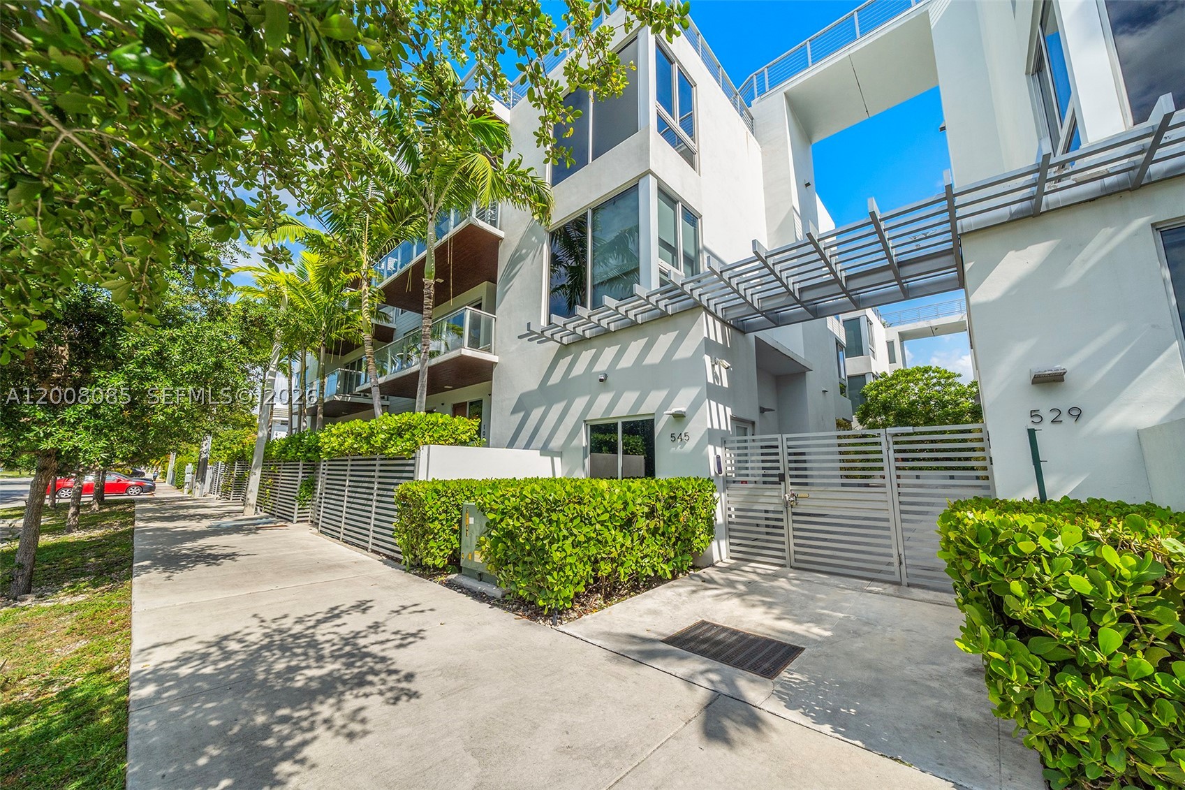 A rare opportunity to own within one of The Roads’ most design-forward boutique buildings, just moments from Brickell yet tucked away in a quiet residential setting. Residence 208 at Eleven in the Roads offers the perfect balance of modern luxury, privacy, and walkable urban living. This spacious 3bd/3ba home features soaring 11-foot ceilings, expansive floor-to-ceiling glass, and an open-concept layout filled with natural light. Thoughtfully designed interiors include Italkraft cabinetry, Bosch appliances, quartz countertops, custom closets, double window treatments, and refined contemporary finishes throughout. Unlike a traditional high-rise experience, Eleven in the Roads offers an intimate boutique atmosphere with only 24 residences, creating a more private and residential feel while remaining minutes from Brickell, Coconut Grove, Key Biscayne, and Downtown Miami. Ideal for buyers seeking a turnkey, lock-and-leave lifestyle without sacrificing space, design, or convenience, this residence delivers elevated Miami living in one of the city’s most connected neighborhoods.