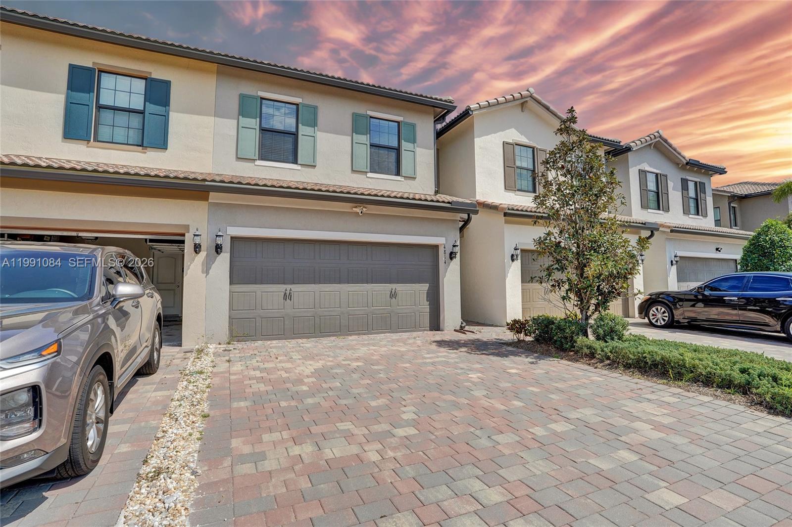A like-new townhome with beautiful lake views in the highly desirable gated community of The Fields at Lake Worth by DiVosta Homes. Built in 2022, this modern Leland model offers 3 bedrooms, 2.5 bathrooms, a two-car garage, and approximately 1,900 sq ft of upgraded living space. The open-concept floor plan features elegant plank-style tile flooring and a bright, spacious layout designed for modern living. The chef’s kitchen includes a large quartz island, stainless steel appliances, and 42” cabinetry, making it perfect for entertaining and everyday comfort. The expansive primary suite provides a relaxing retreat with a walk-in closet and a well-appointed bath featuring dual vanities, quartz countertops, and a frameless glass shower. From the private patio, enjoy serene lake views and peaceful sunrises, creating the perfect outdoor escape. Additional highlights include impact-resistant windows and doors, energy-efficient construction, a full-size washer and dryer, and high-quality finishes throughout. Residents of The Fields enjoy resort-style amenities including a clubhouse, fitness center, tennis and basketball courts, and a resort-style pool. Conveniently located near shopping, dining, A-rated schools, and the Florida Turnpike, this home offers the perfect blend of luxury, comfort, and convenience. Easy to show.