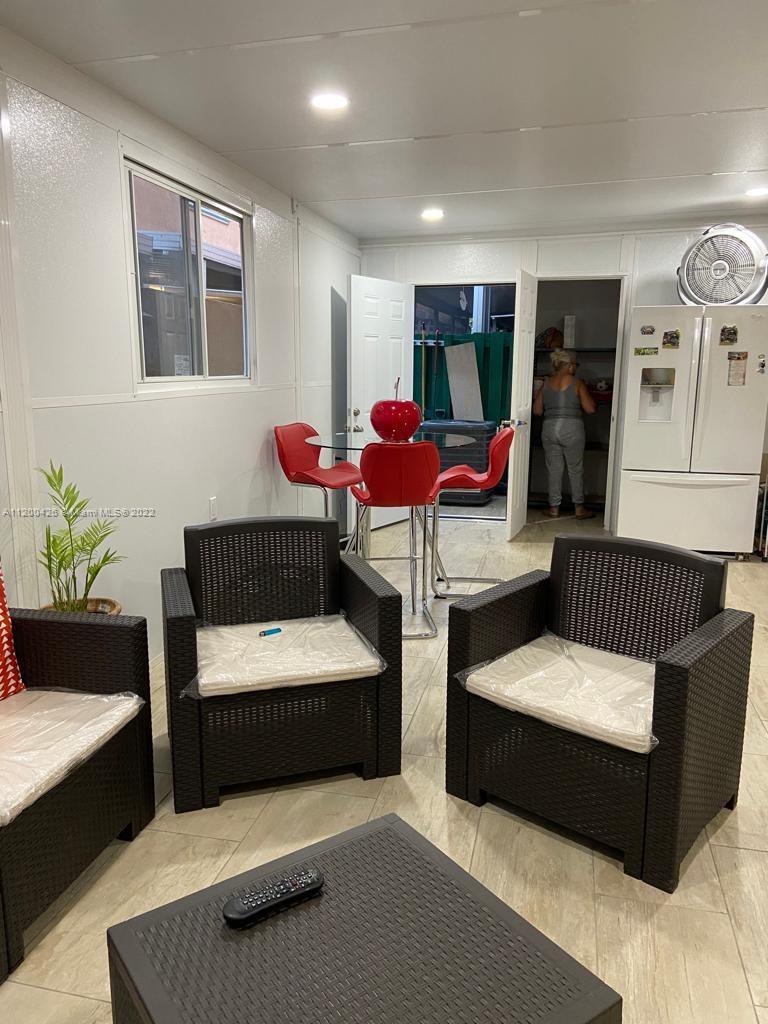This beautiful unit is located on the first floor with two assigned parking spaces!  Boasting over 1,150 sq. ft., it features tile throughout and an amazing enclosed 450 sq. ft. terrace great for entertaining guests.  Excellent opportunity for owner-occupants or investors with no rental restrictions.  This gated community is located close to restaurants, shopping & major highways.  Seller relocating & motivated!  This deal with not last!  Realtors -  Patio was enclosed and one small bedroom added to interior of unit without permits.  SEE BROKER REMARKS FOR SHOWING SCHEDULE DUE TO TENANT-PLS DO NOT DISTURB TENANTS.