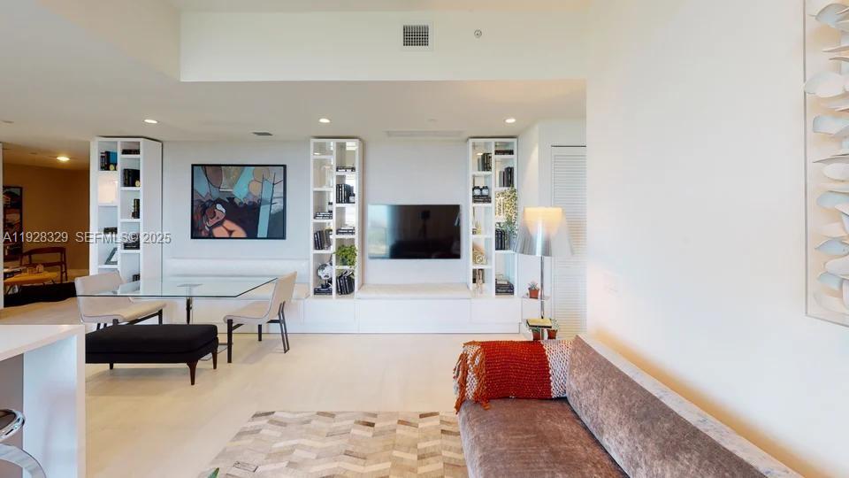 Discover this impressive 3-bed/3-bath former model unit at the iconic Metropica Tower—one of the most beautifully designed residences in the building. Partially furnished and curated by a professional interior designer, this home features custom closets, upgraded finishes, premium lighting, and elegant built-ins that elevate every corner. A true turn-key luxury home. Enjoy 5-star, resort-style amenities: stunning pool deck, cabanas, state-of-the-art gym, spa, tennis courts, business center, kids’ room, lounge, and more. The unit is tenant-occupied and impeccably maintained. Located steps from Sawgrass Mills, fine dining, entertainment, and major highways. Style, location, and value—this is one of the most desirable units in Metropica.